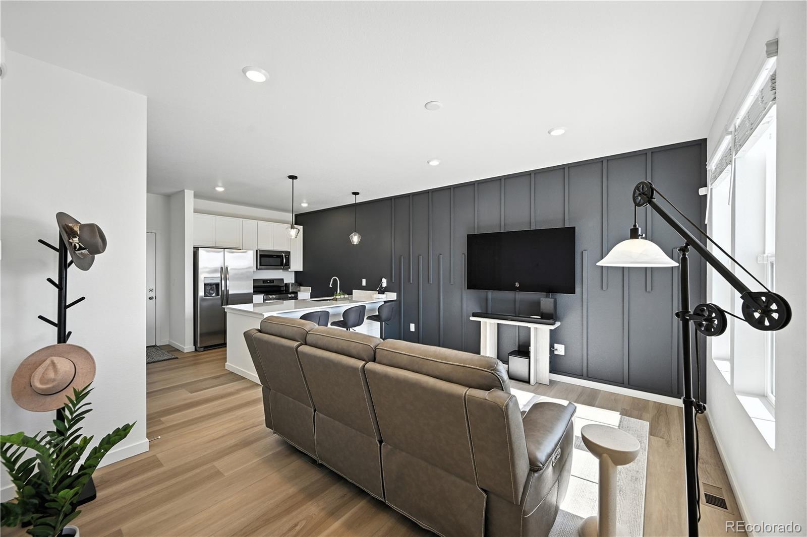 Image 4: Enter an inviting living room with a beautiful custom accent wall.