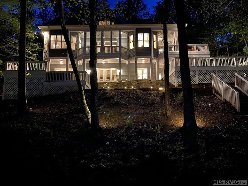 Image 3: Lakeside Home At Night