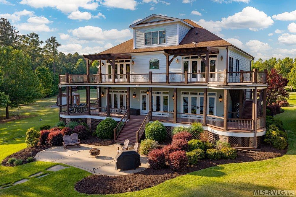 Image 2: Lake Gaston Luxury Living, This exquisite Lake Gaston luxury estate perfectly blends grandeur with comfortable waterfront living.