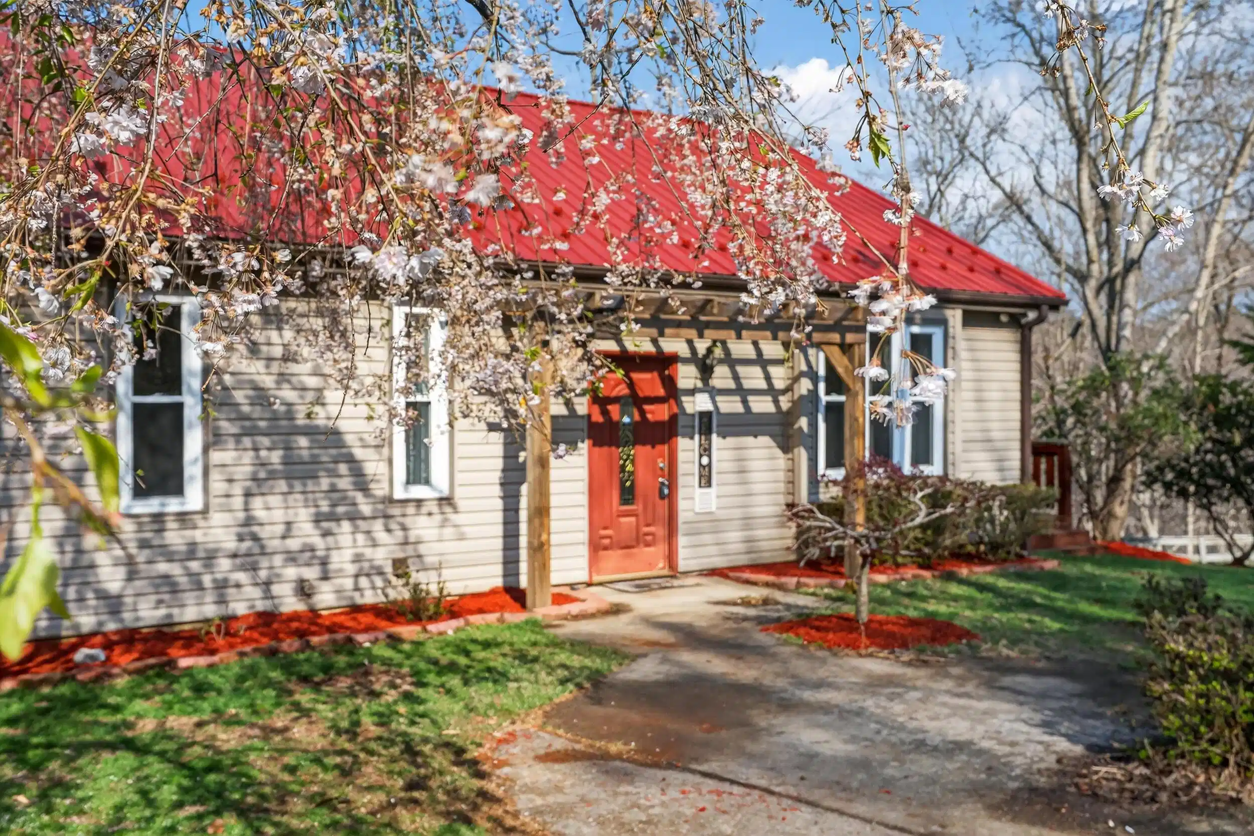 Image 1: front door with cherry tree
