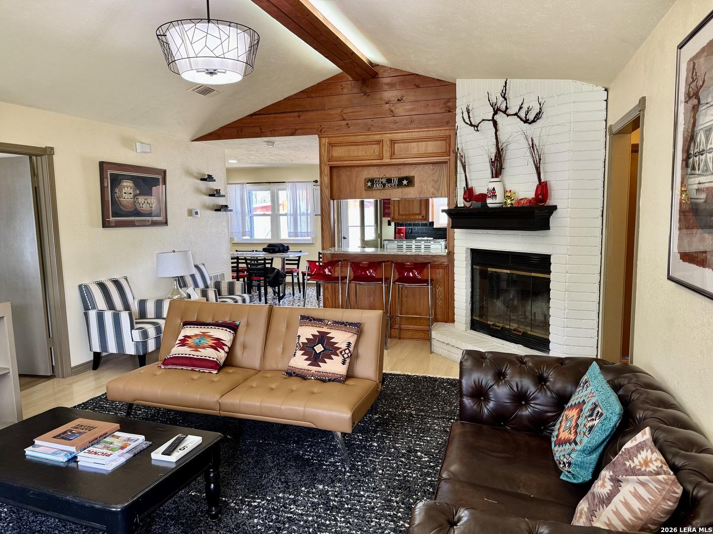 Image 3: Living Room, Fireplace, and Breakfast Bar