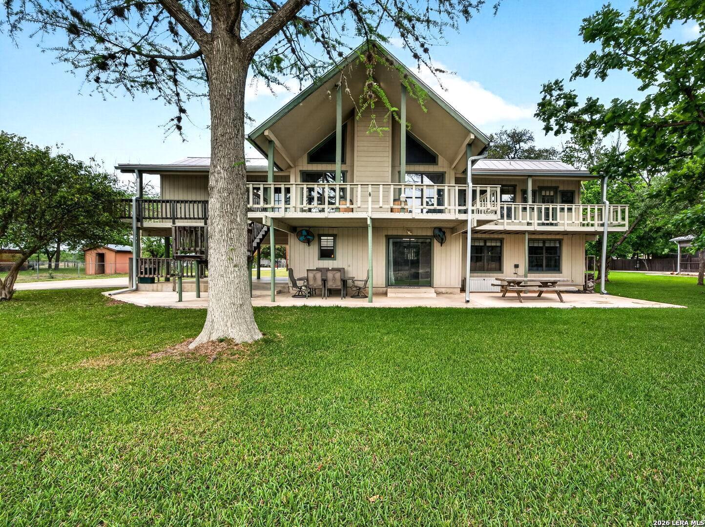 Image 1: Back of House facing the Lake and View