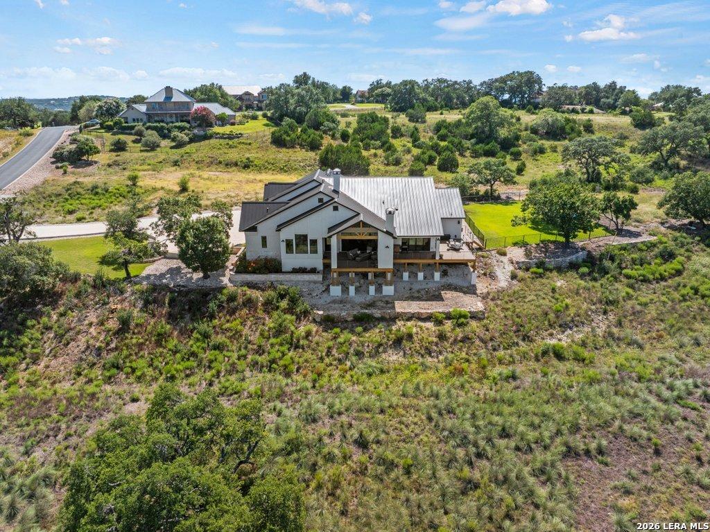 Image 4: Side view of outdoor living facing lake