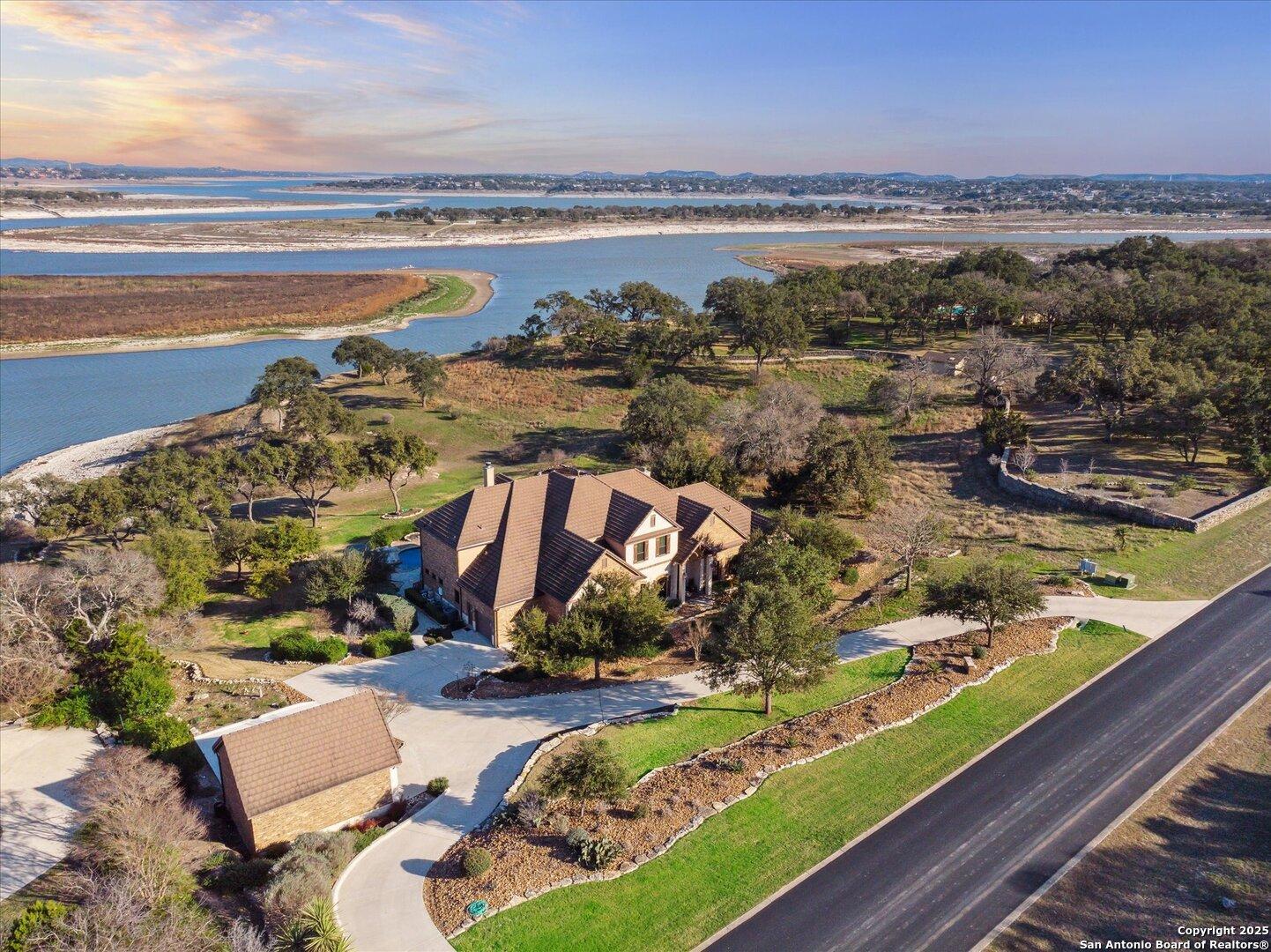 Image 1: Front view of property and lake front.