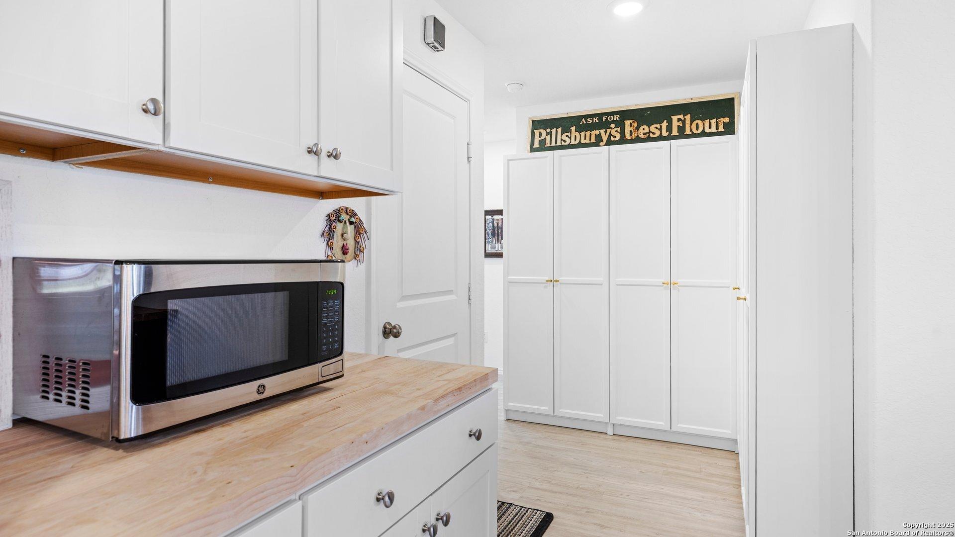 Image 3: Added cabinets for storage