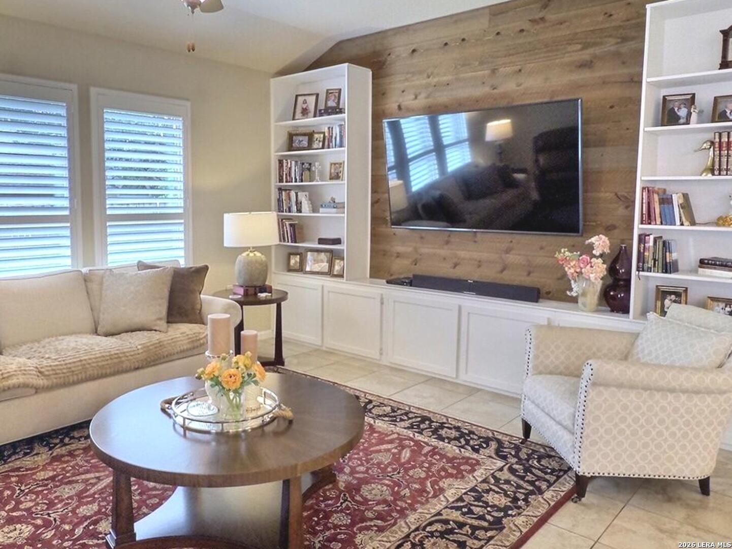 Image 2: Custom wood feature wall and built in shelvings