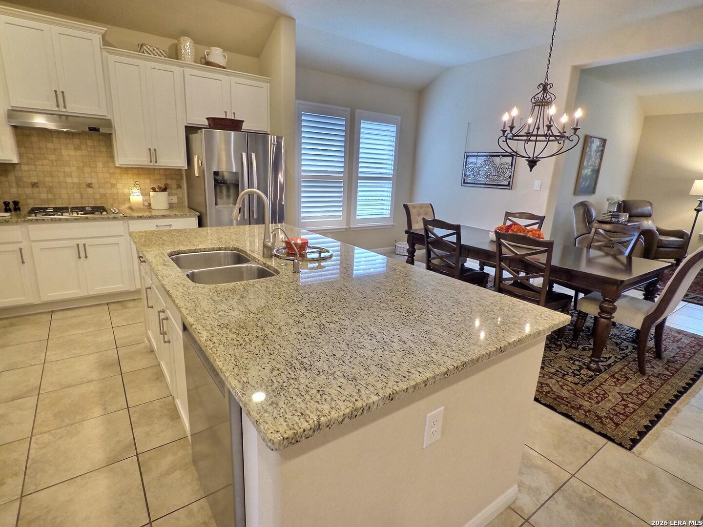 Image 3: Large granite island, stainless steel appliances