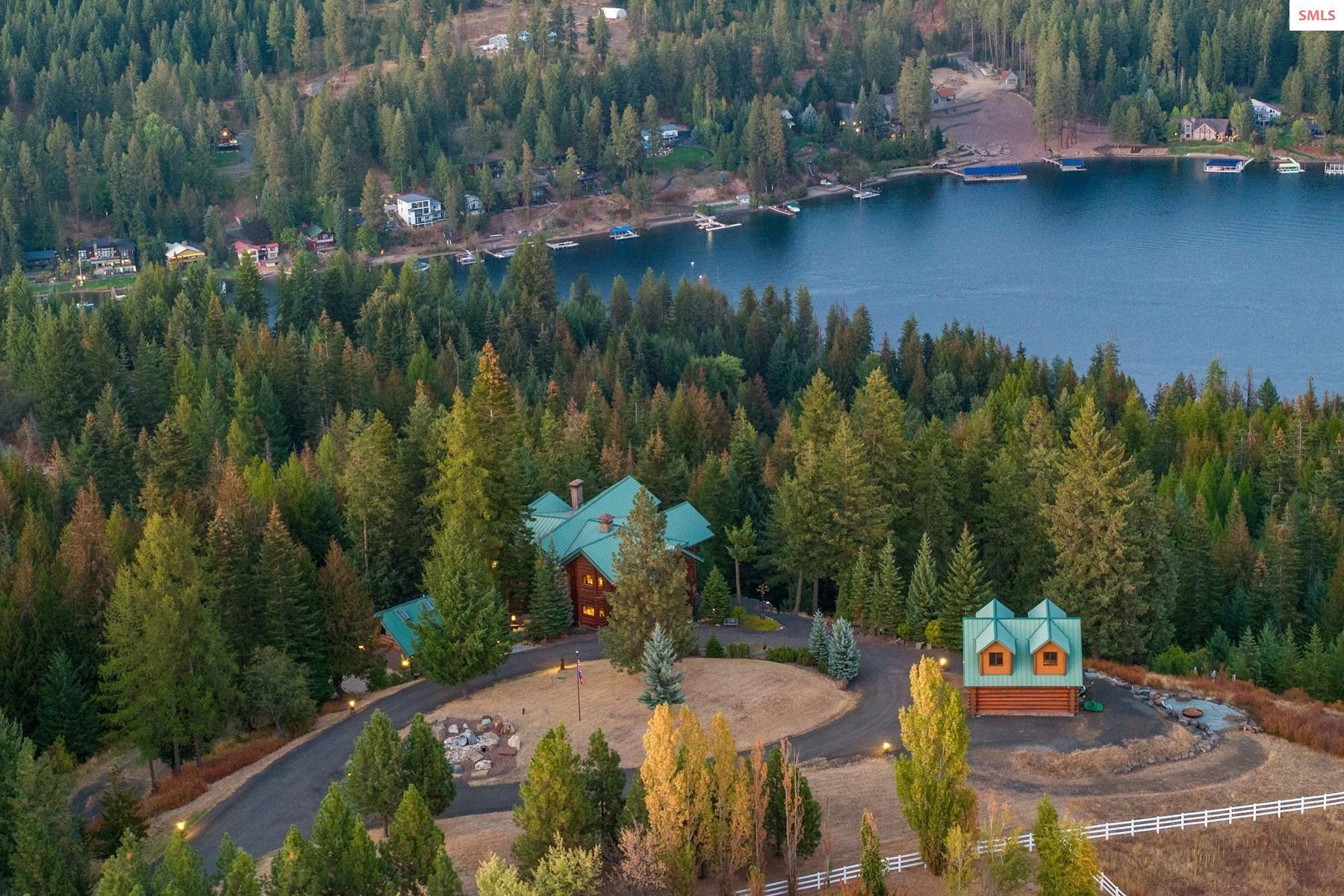 Image 1: with CdA Lake Views, stunning 8000 + SF Custom log home, Shop, garage, trails and more.