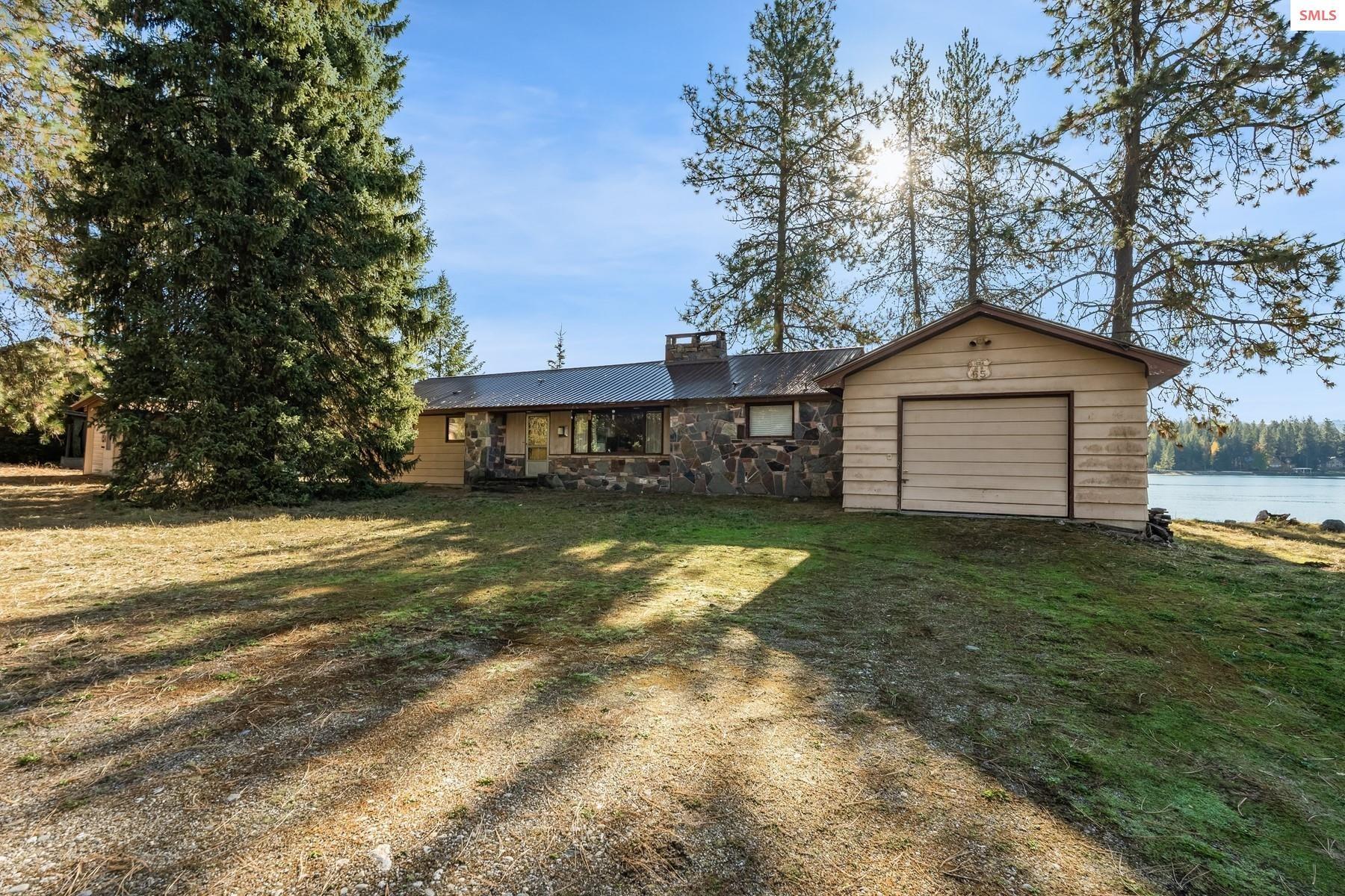 Image 4: Front of residence features attractive stonework