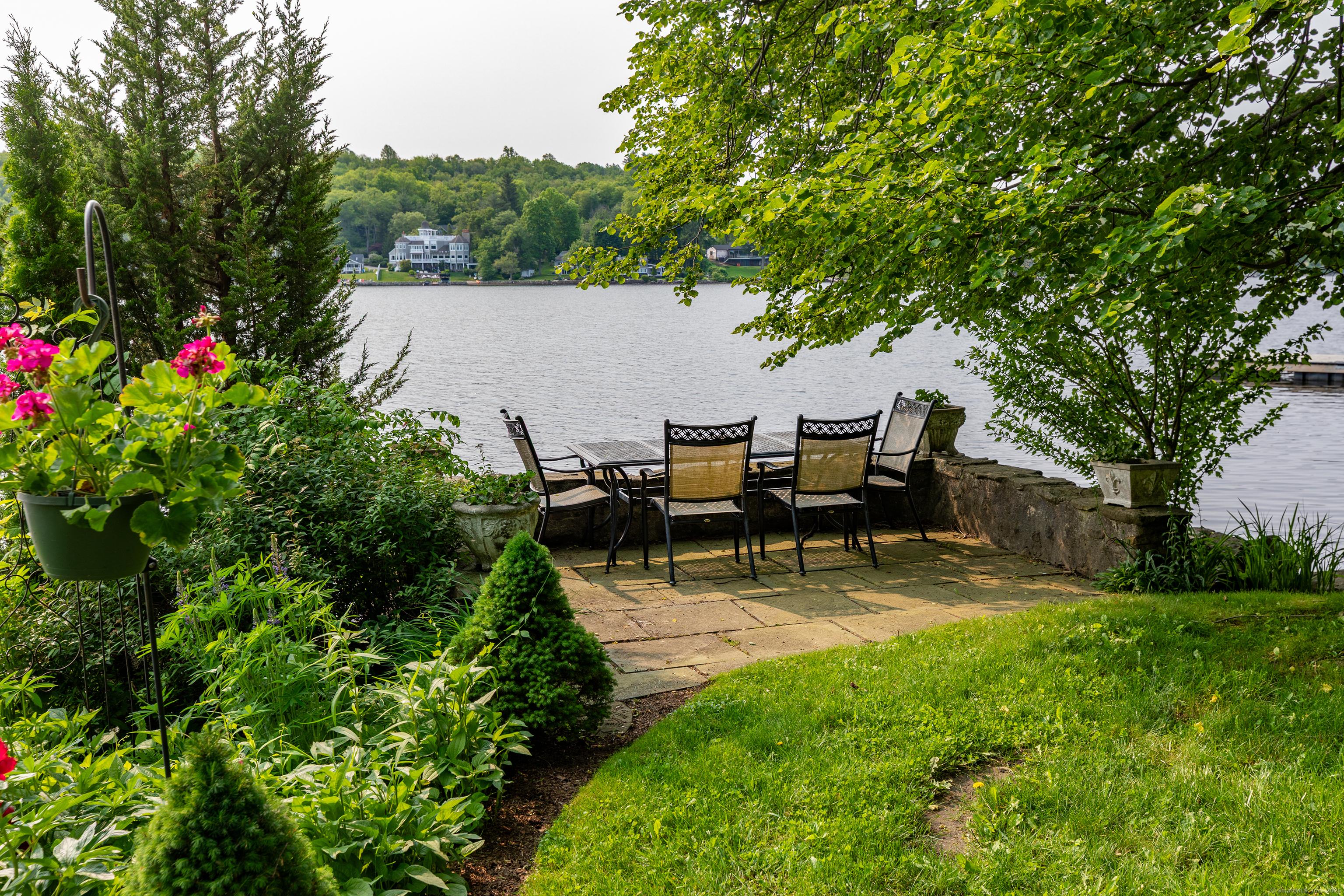 Image 4: Stone waterfront dining area