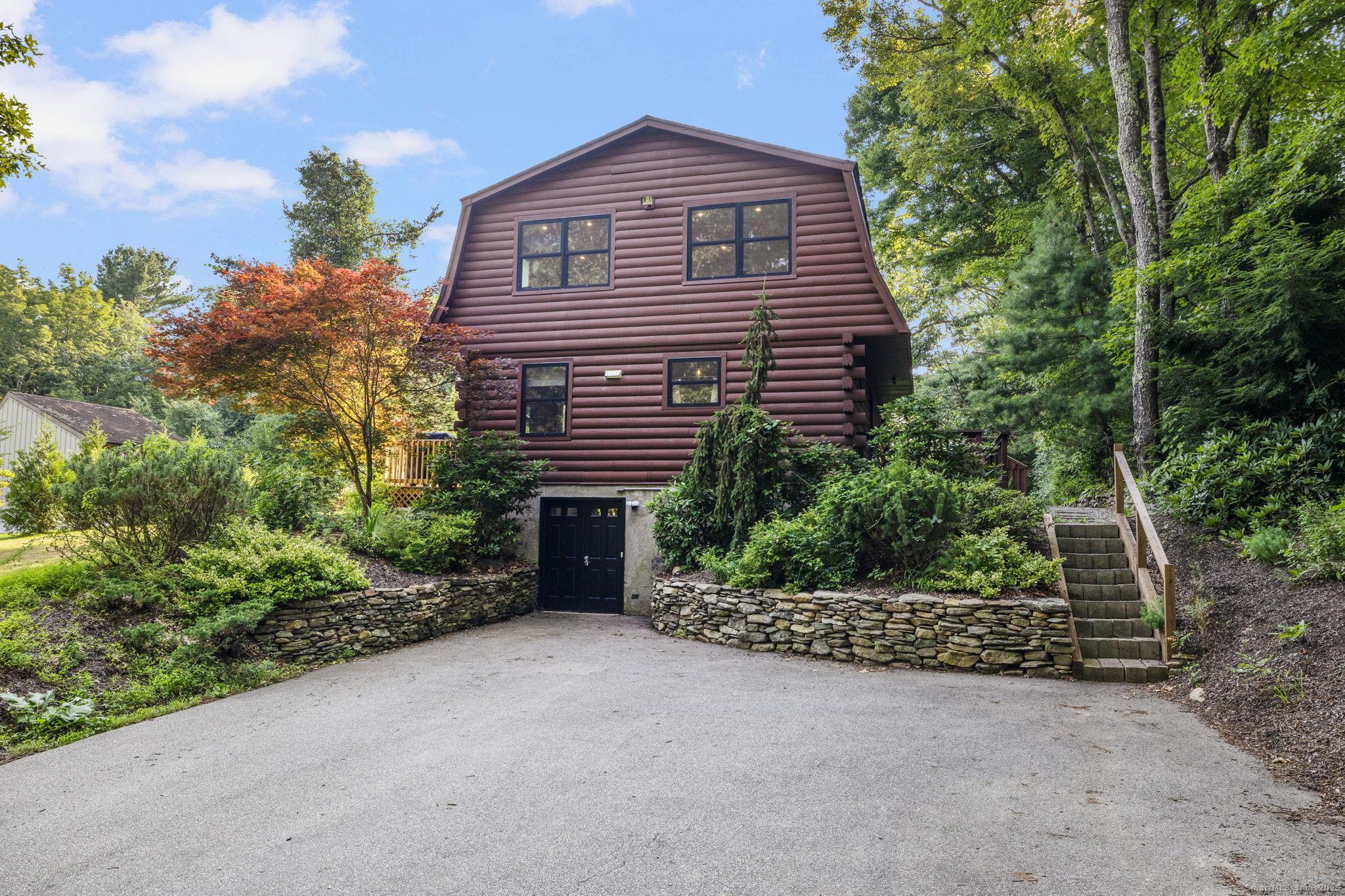 Image 1: Welcome to your dream home in the Witches Woods Lake District! This fully renovated property offers lake views, beach access, and a long list of thoughtful upgrades