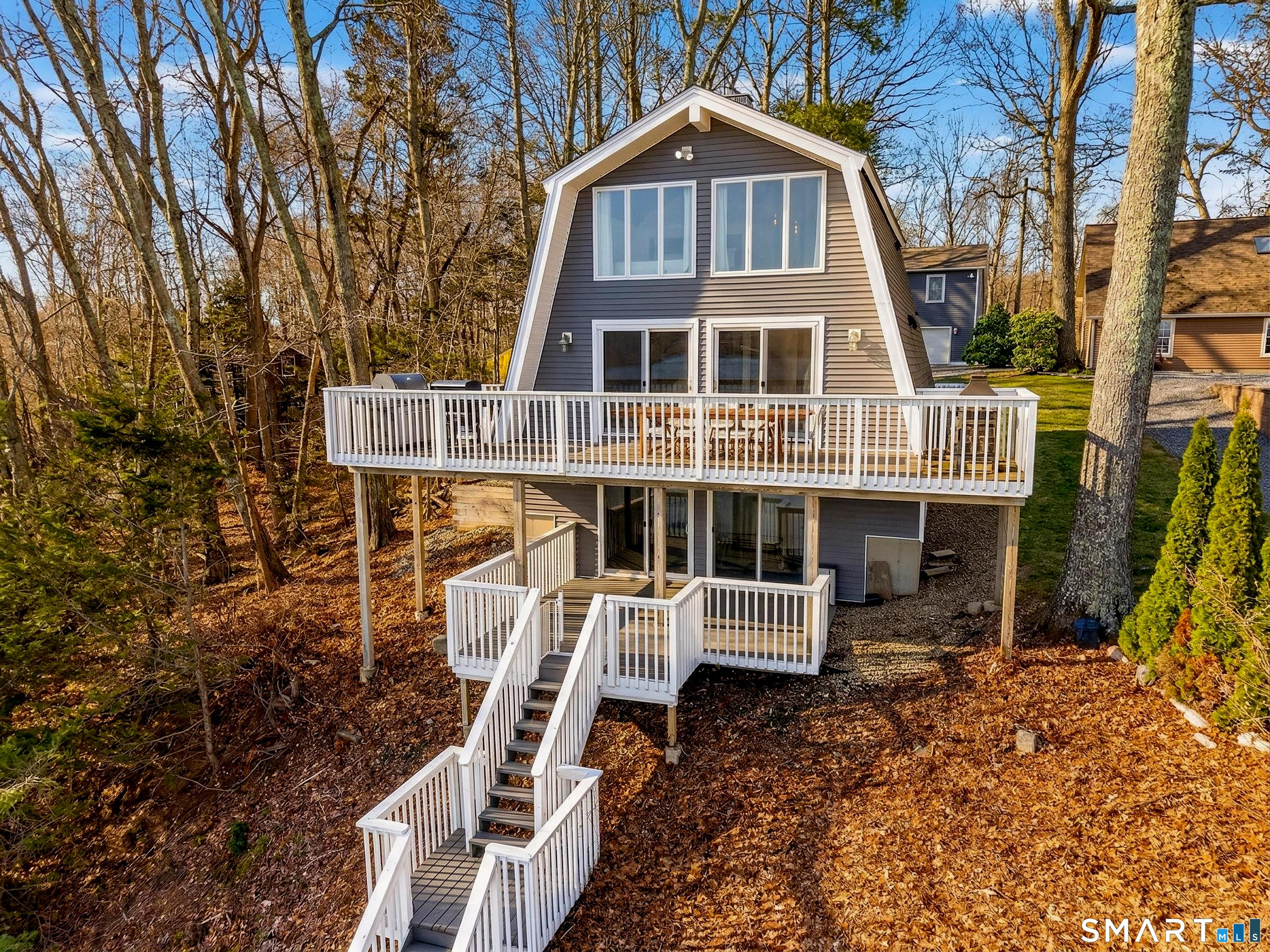 Image 2: Set up like a treehouse, each level provides jaw-dropping views of Gardner Lake