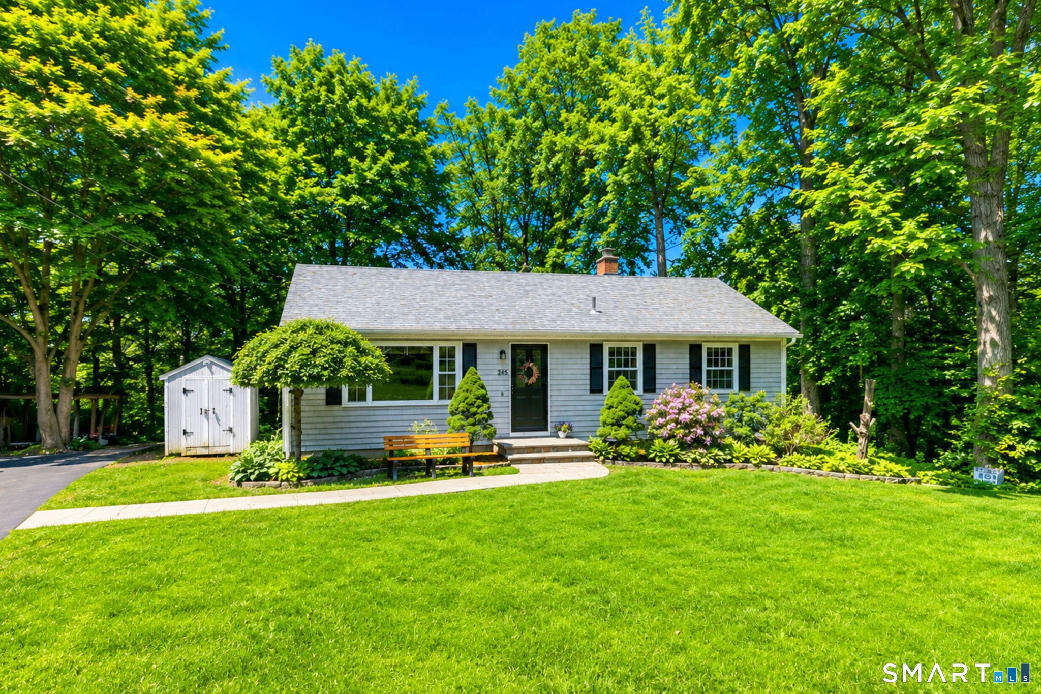 Image 2: A perfect place to call home! A bluestone walkway and plantings lined with Belgium block leads you to the front door.