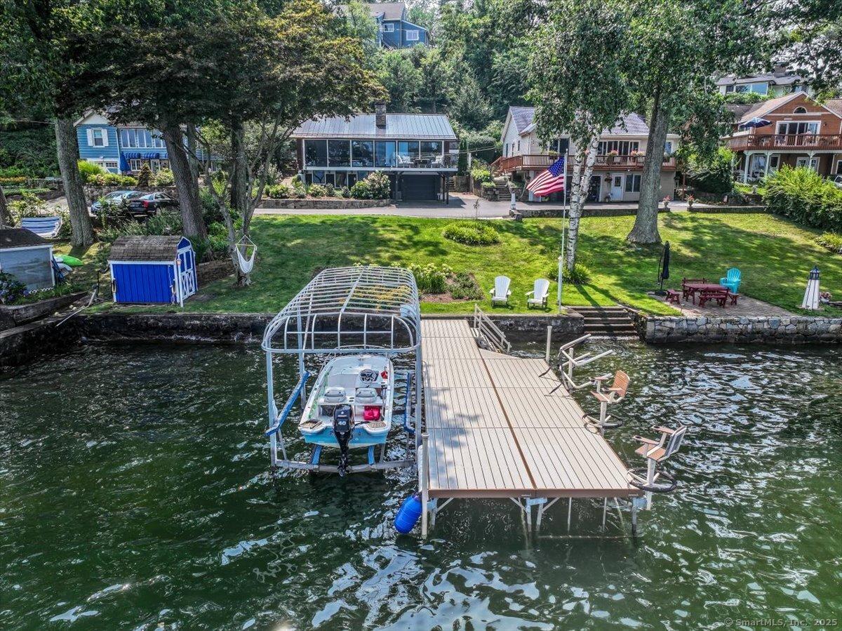 Image 1Front Yard: The Lake is your front yard, dock, shed, sea wall, garden steps to lake