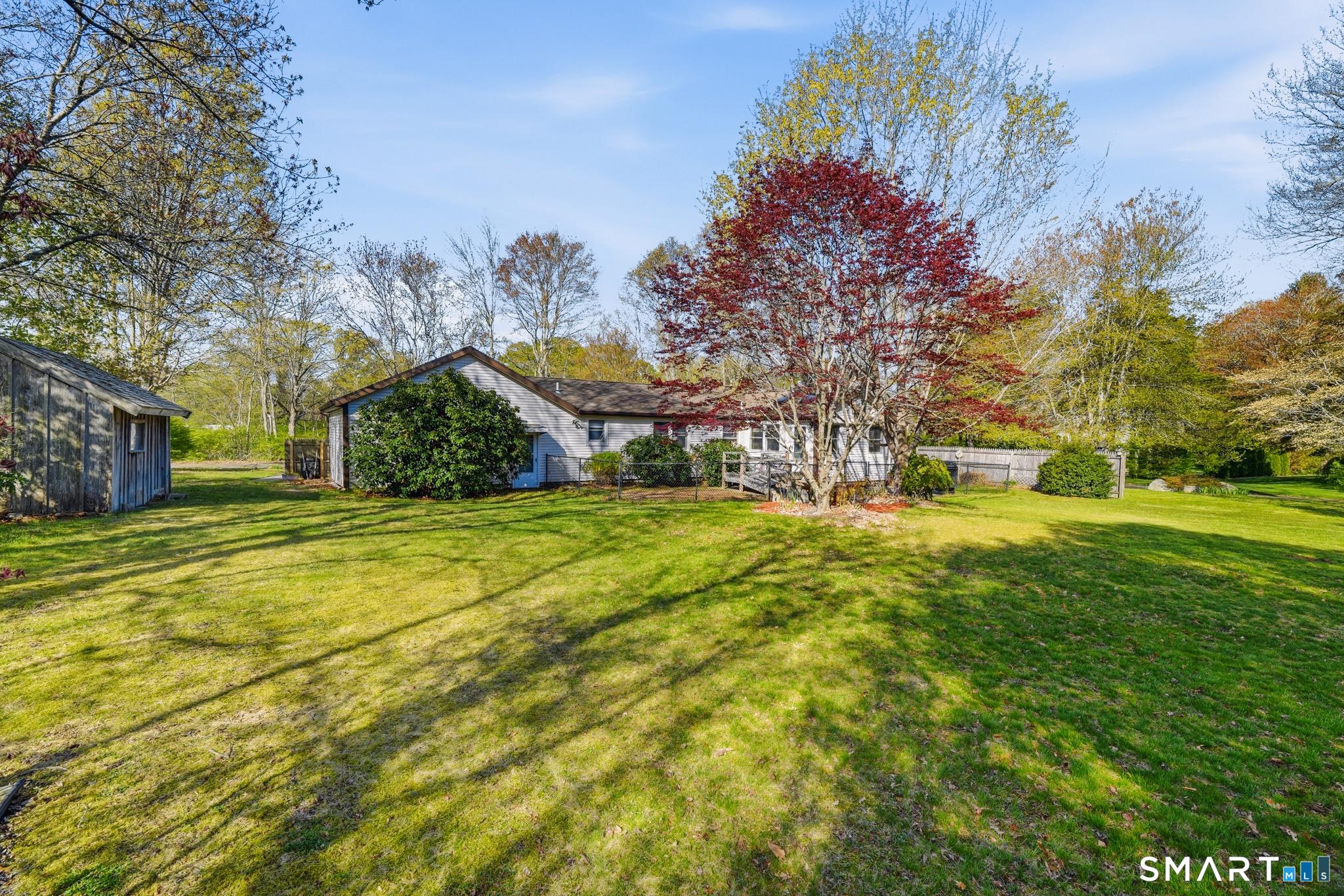 Image 3Back of House: This backyard offers the perfect balance of sun and space to let your landscape dreams take root.