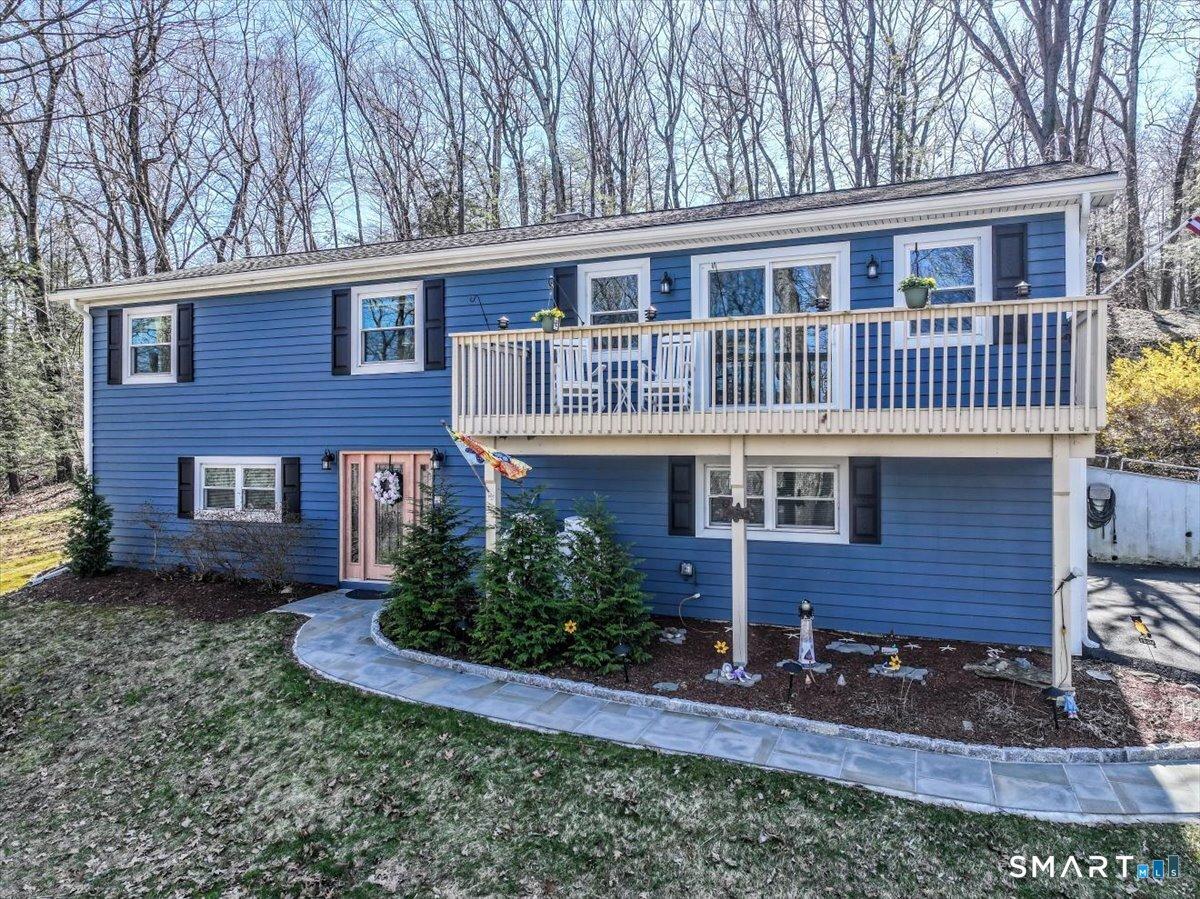 Image 2: Welcoming raised ranch. New walkway, new siding, new windows and a new roof all greet you in style!