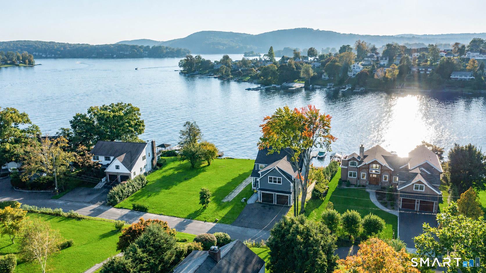 Image 2: Drone shot of direct waterfront home