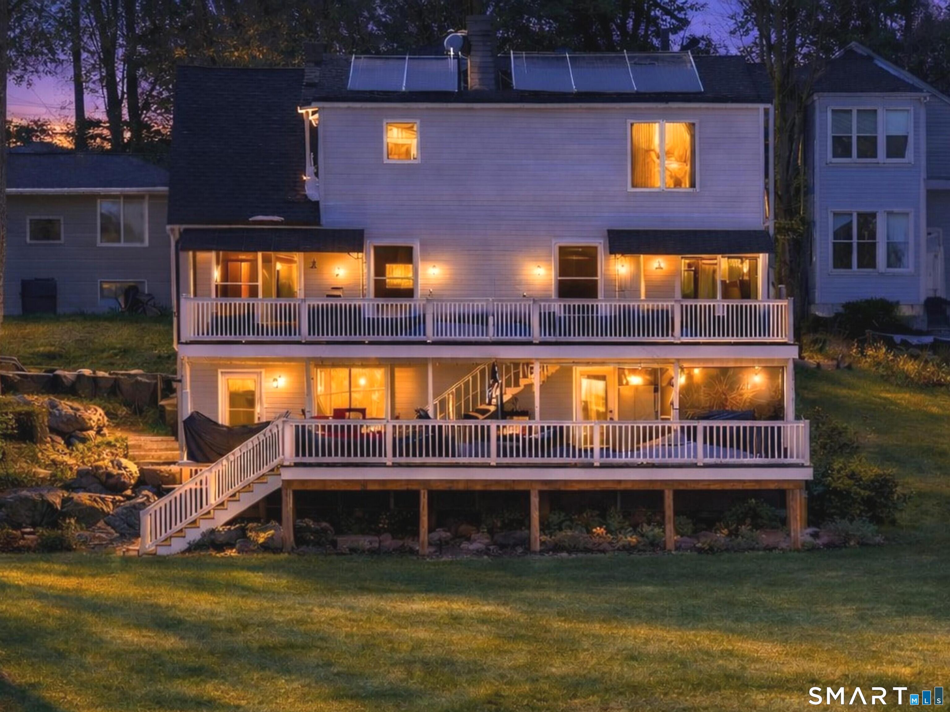 Image 1Back of House: Imagine soaking in the hot tub on a beautiful summer night