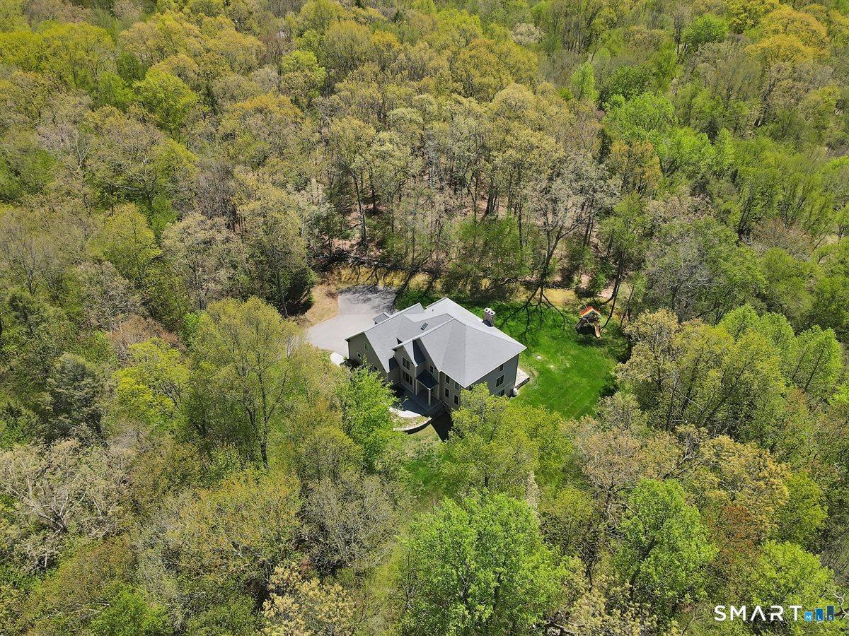 Image 1Aerial View: Nestled on almost 4 acres
