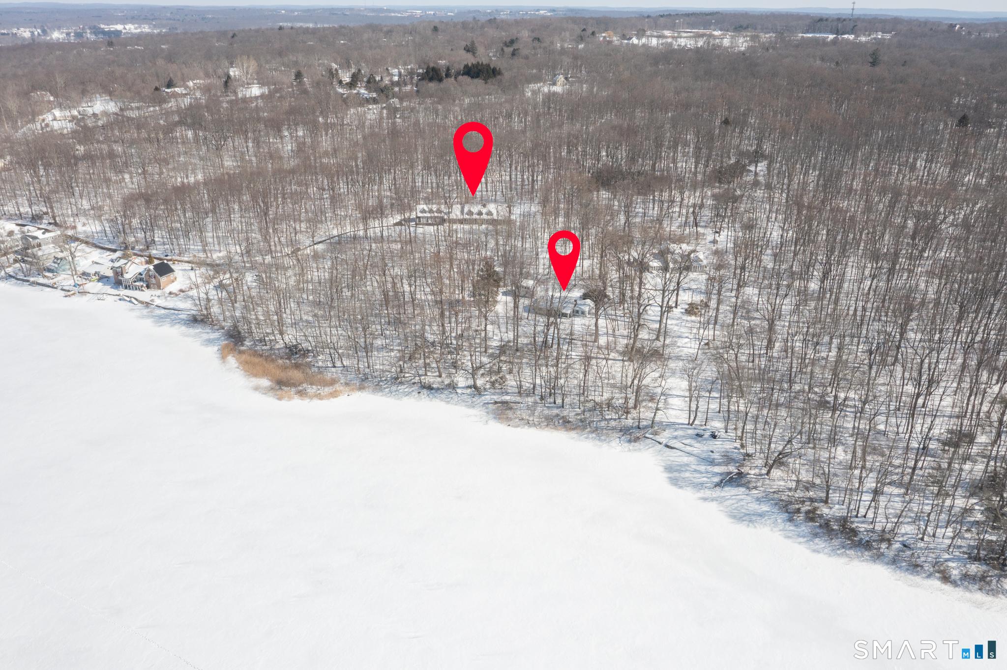 Image 4: Privacy, approximately 700 feet of lake frontage and TWO HOUSES! keep clicking to see photos of the beautiful back yard with stone walls, arbor, stone stairway and mature flower beds.