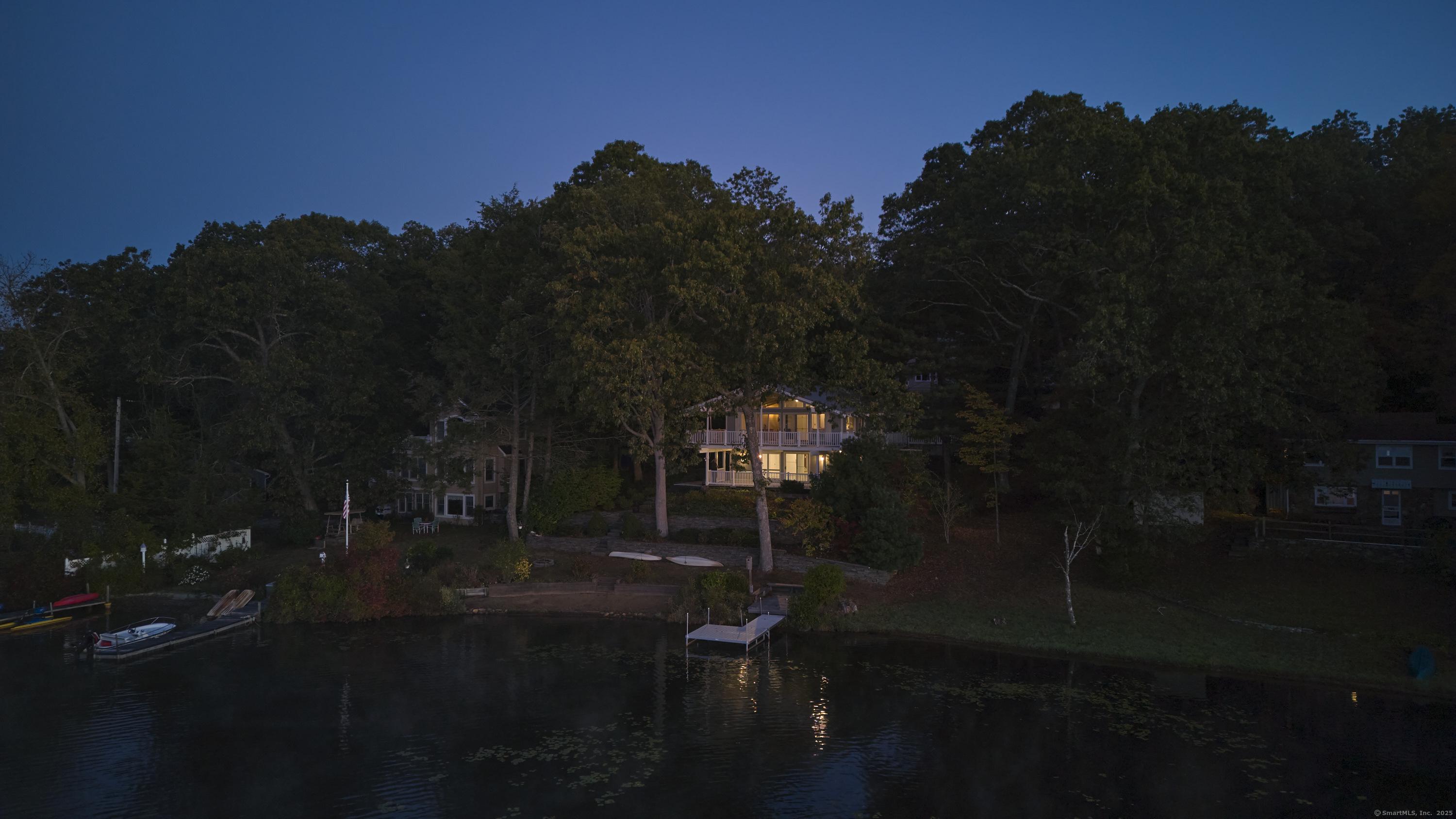 Image 2Waterfront: Twilight Reflections - Evenings shimmer with sunset colors over the water.
