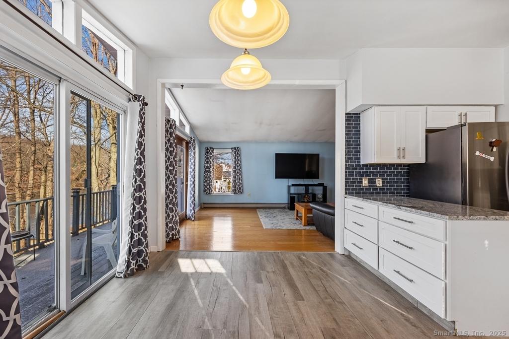 Image 2: Kitchen dining area view of living room