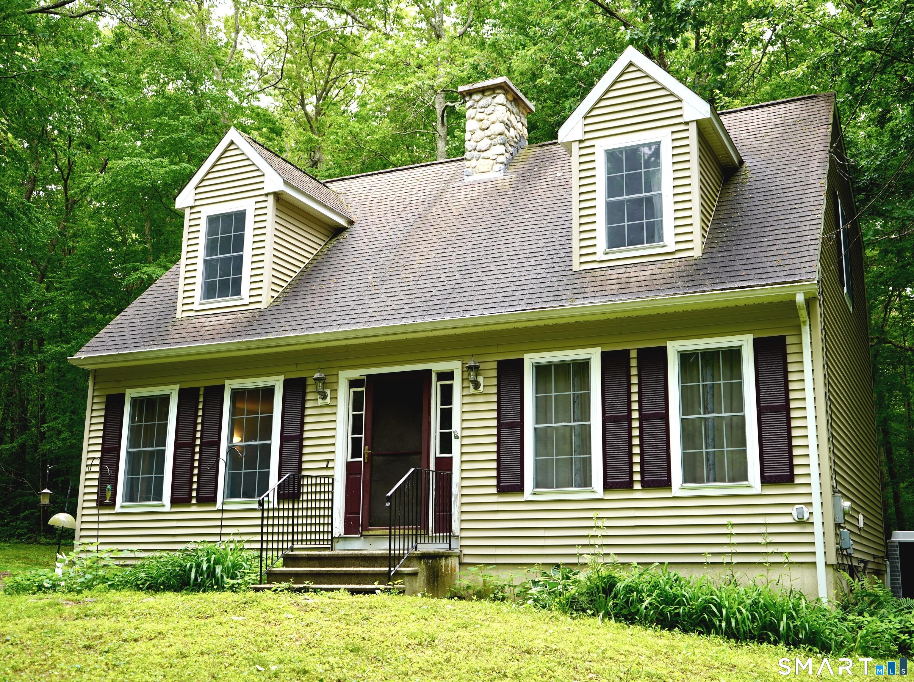 Image 1Front of House: Year-round lake-life living in this charming Cape nestled within the highly desirable Lake Williams community.