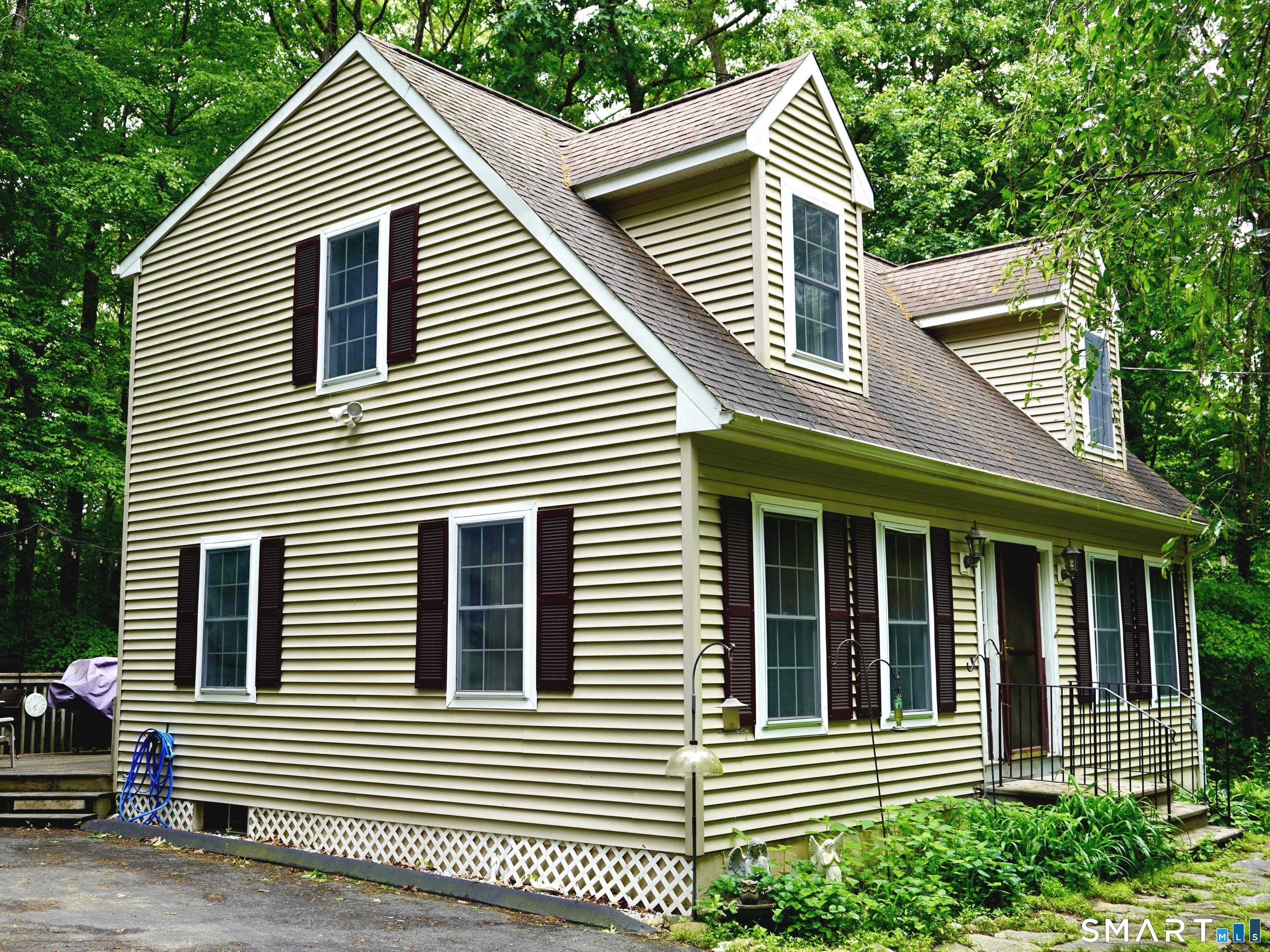 Image 2Side of Structure: This affordable home sits on a private 1 acre lot.