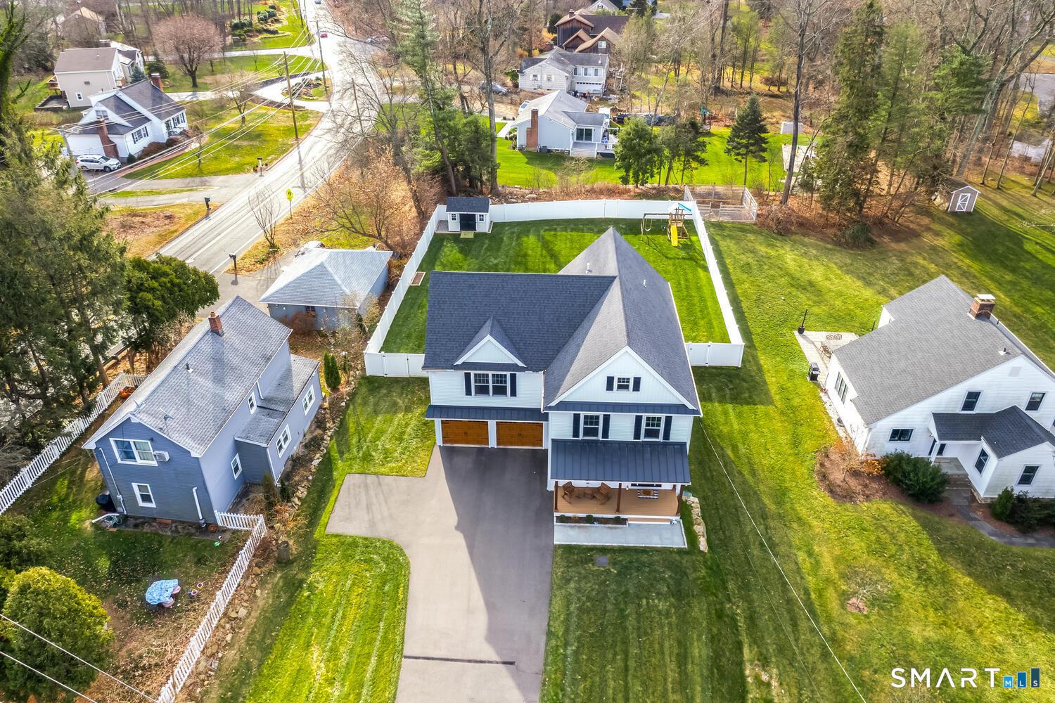 Image 4Aerial View: Showing the home and the rear fenced in yard.
