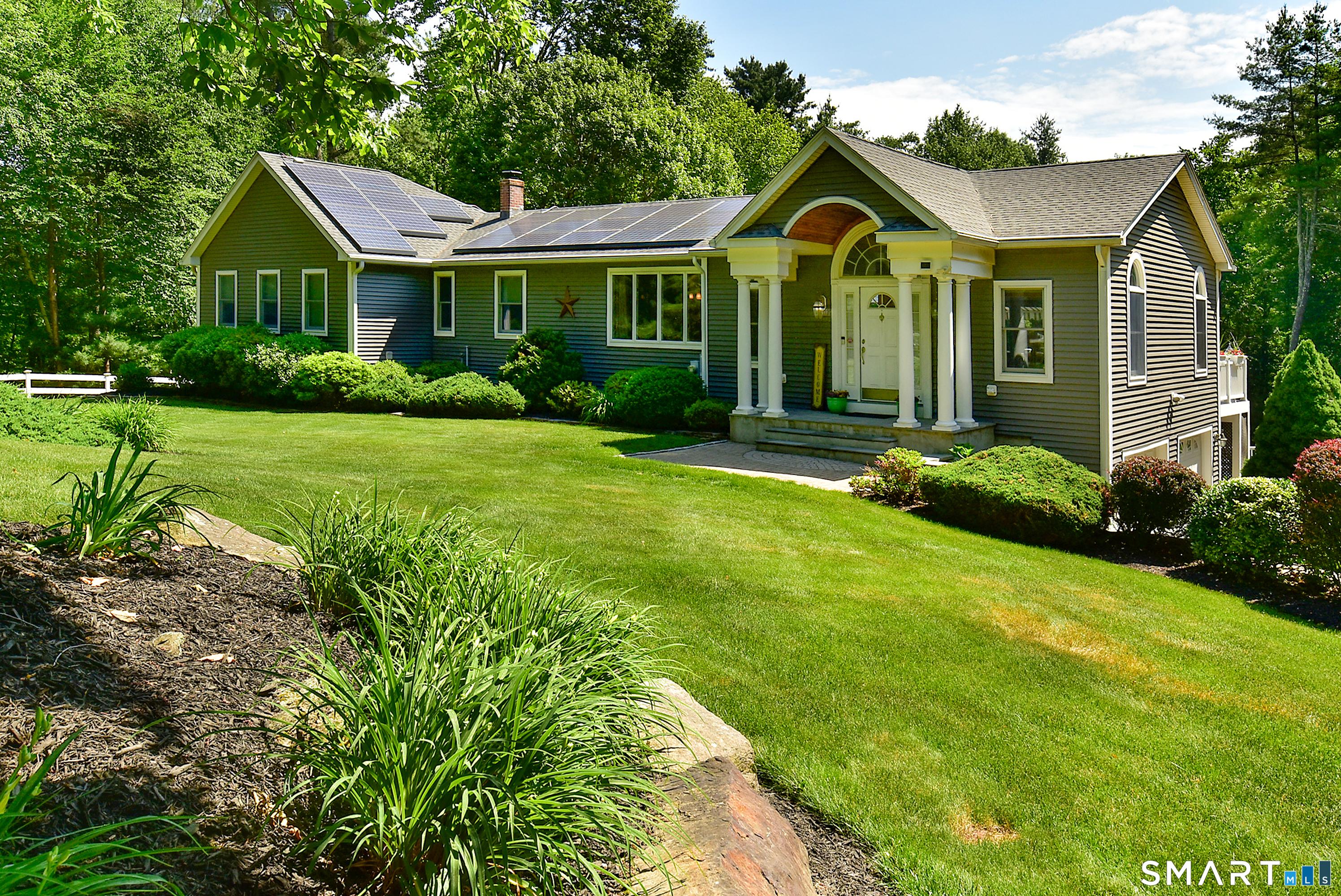 Image 2Front Yard: This home and property have everything you want... privacy, a generous-sized deck overlooking a heated pool, blooming perennial gardens and spacious lawn... Located on a quiet and non-traffic street, but close to schools, restaurants and shopping.