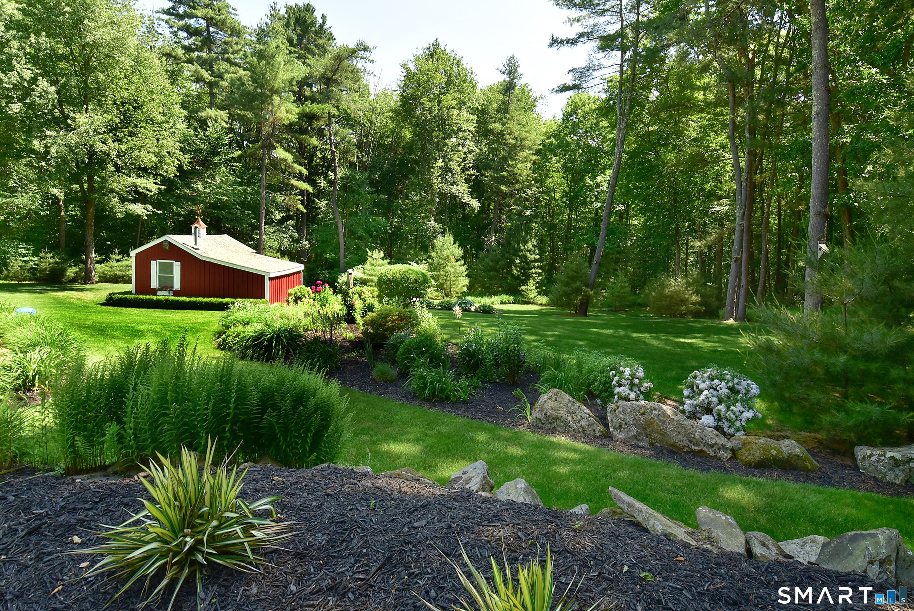 Image 3: There is a shed constructed of wood from this property! Plenty of storage and a double door in the back that accommodates a riding lawnmower and all of your yard tools.