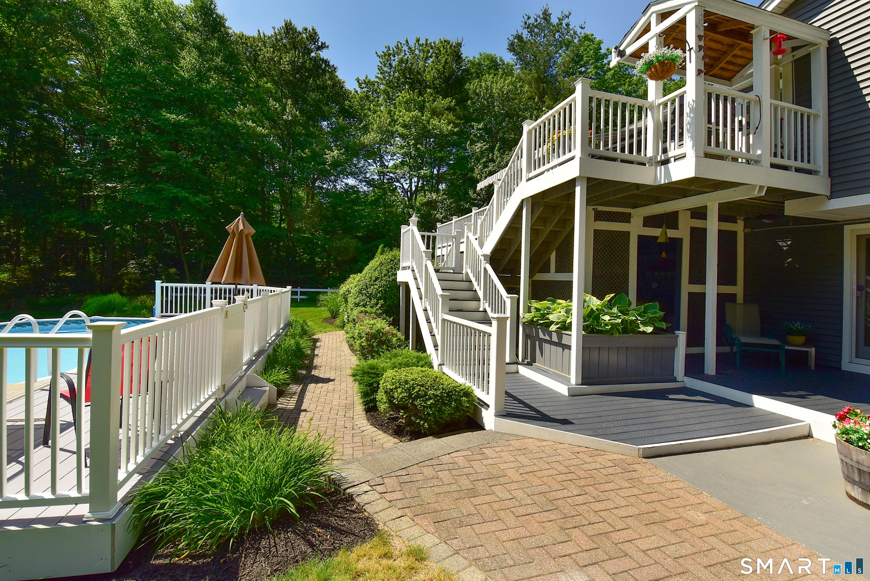 Image 4: Your trex deck leads down to the private pool area.