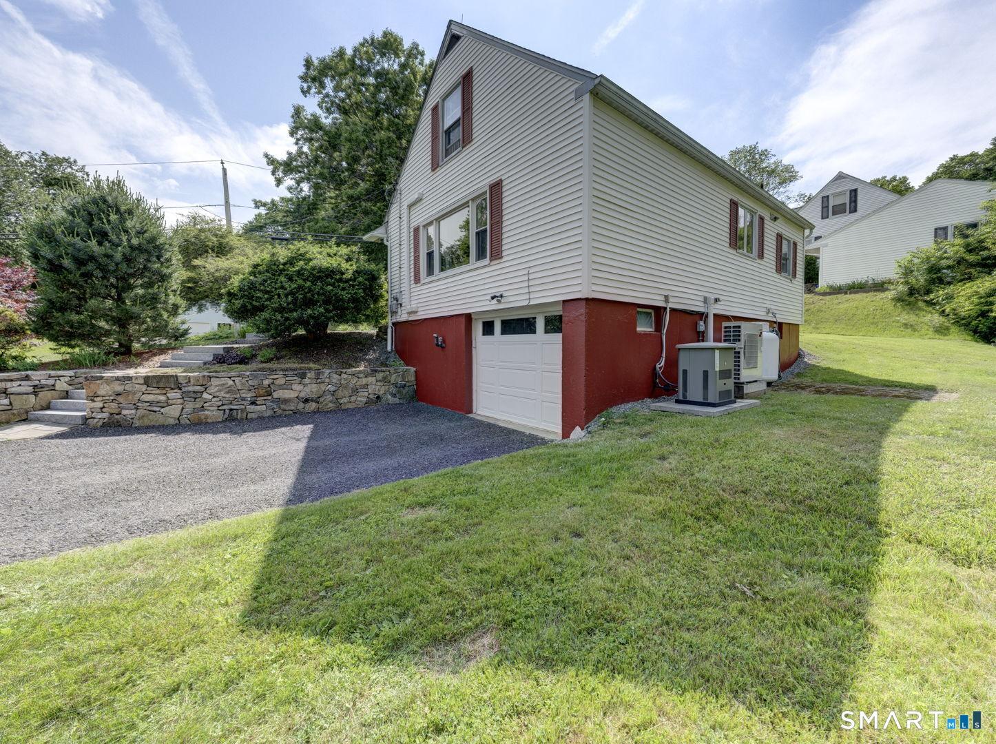 Image 3: New Garage Door, and Newer Driveway