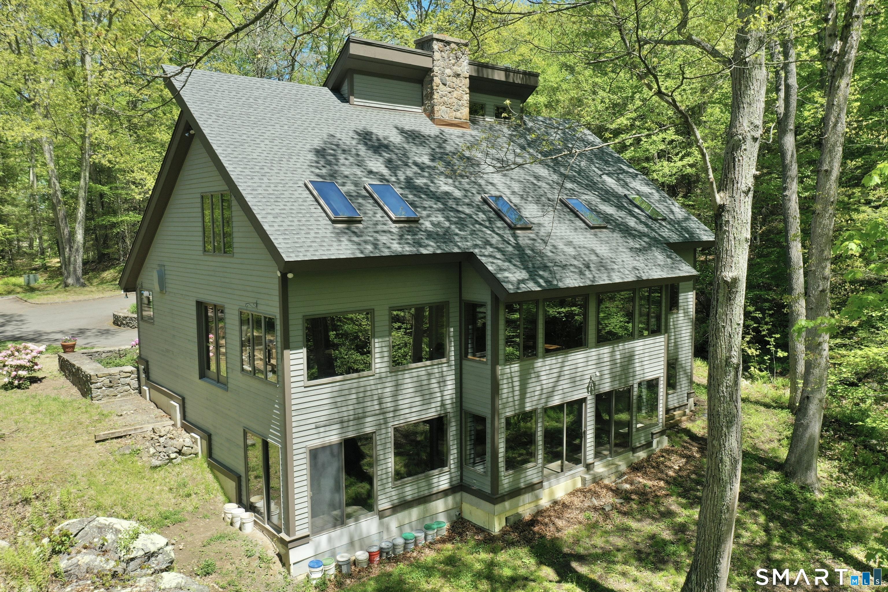 Image 2: Left Rear of Home showing Passive Solar Light and Heat