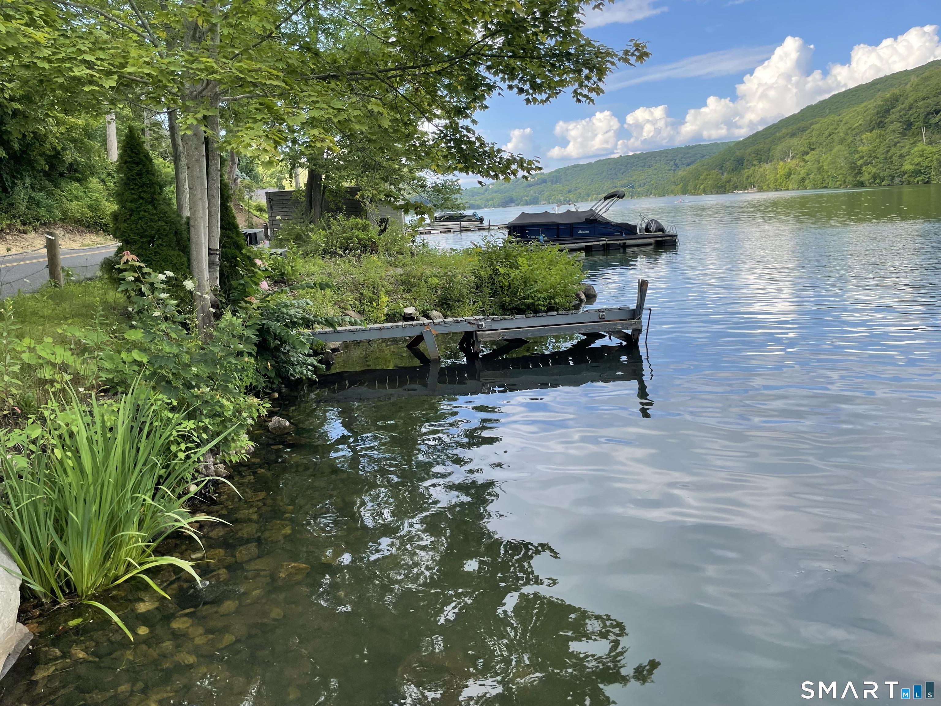 Image 1Waterfront: Rare direct waterfront on Lake Waramaug. Boat belongs to next property