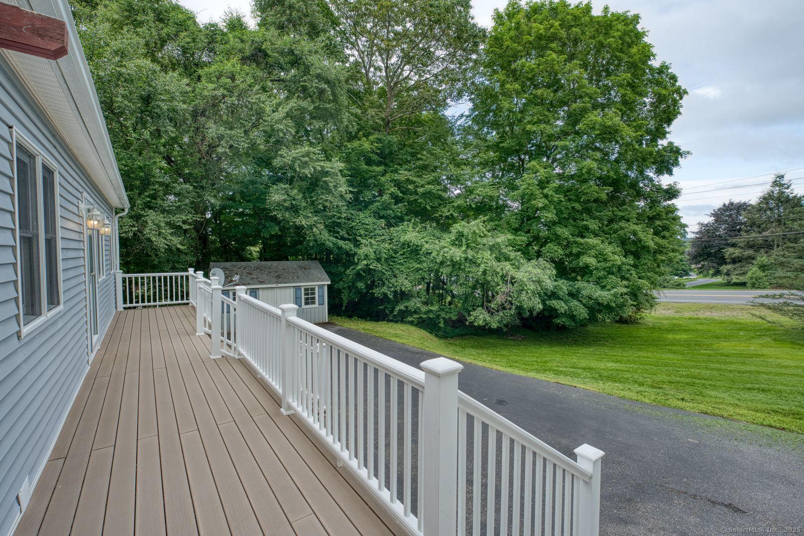 Image 4: Front Deck runs the full length of the house