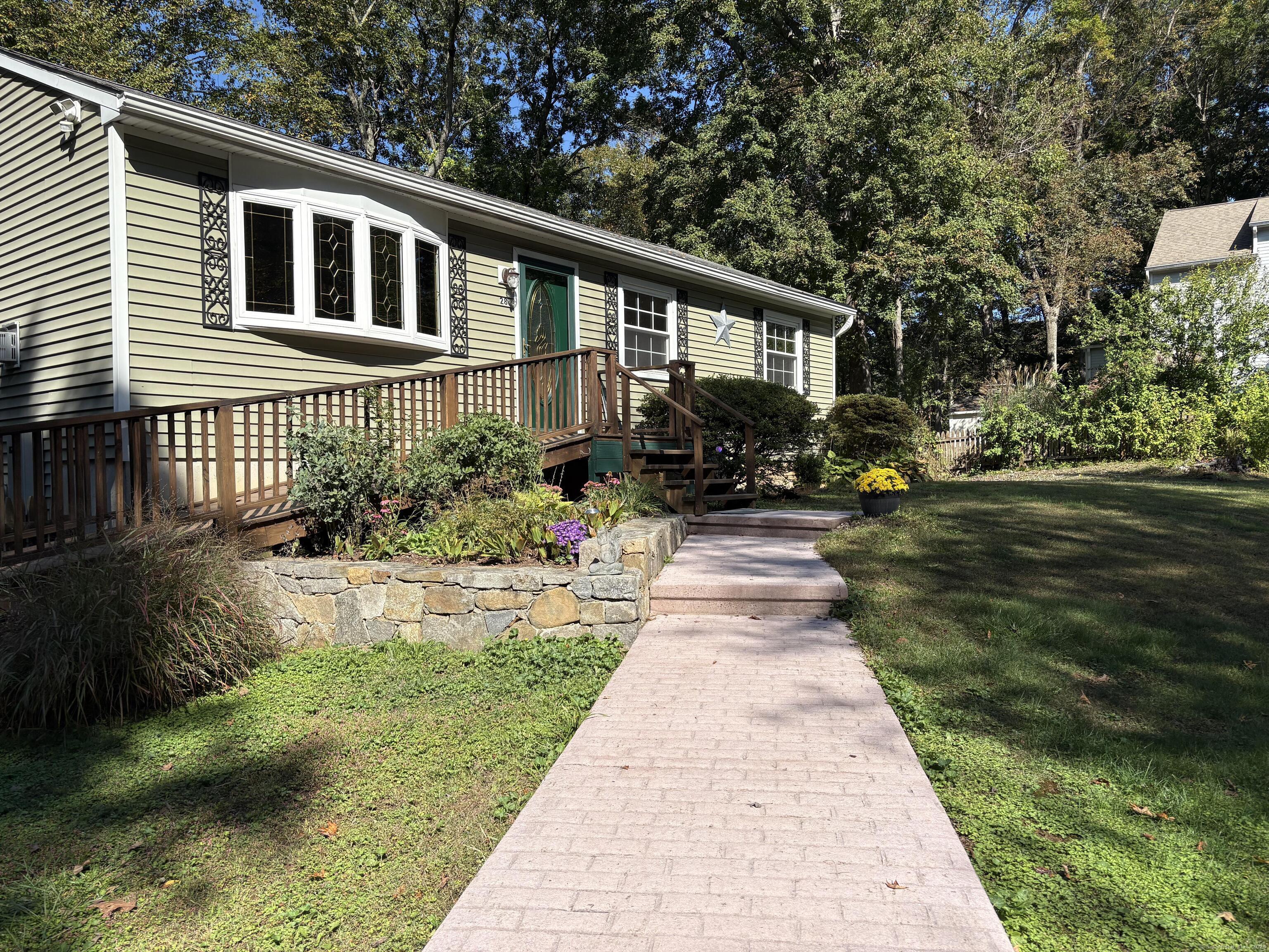 Image 2Front of House: Ramp provides optional ease of entry, but can also be removed