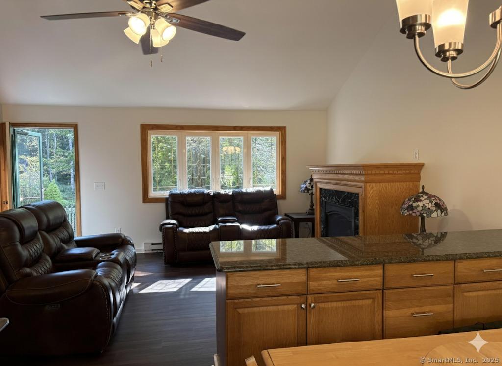 Image 3Living Room: Open flow from living room to kitchen to eating area and back deck is great for entertaining.