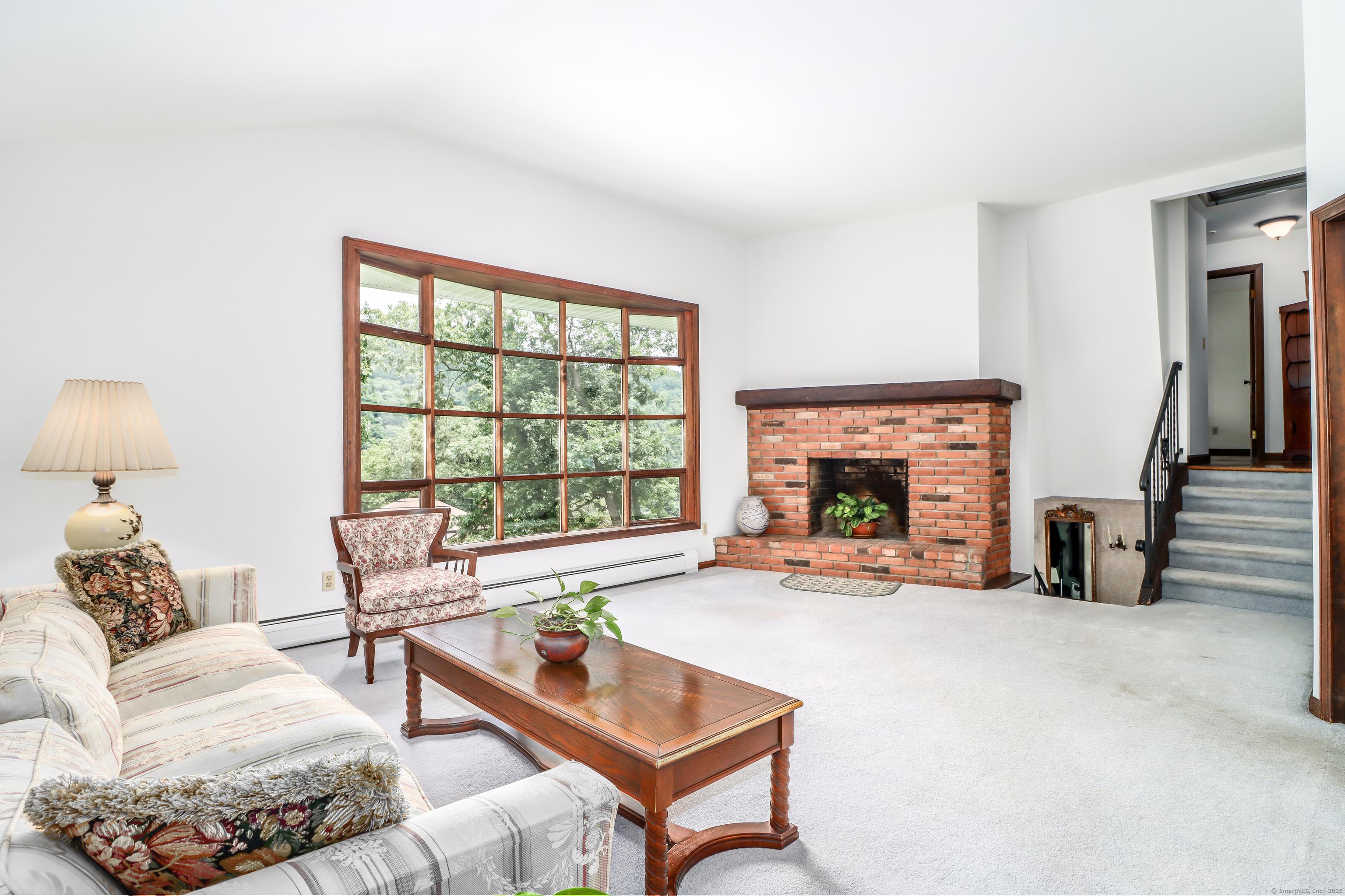 Image 3: Simple carpet removal will expose gorgeous hardwood floors