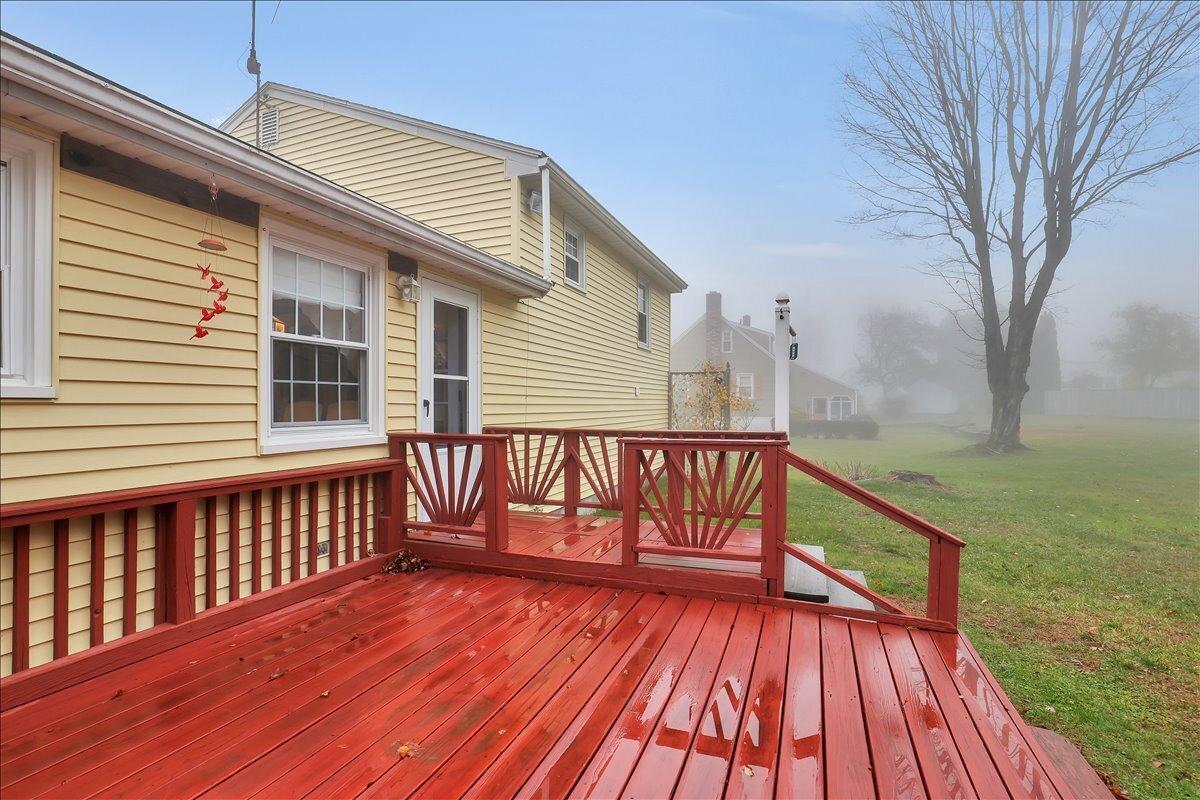 Image 4Back of House: Back deck overlooking level yard.