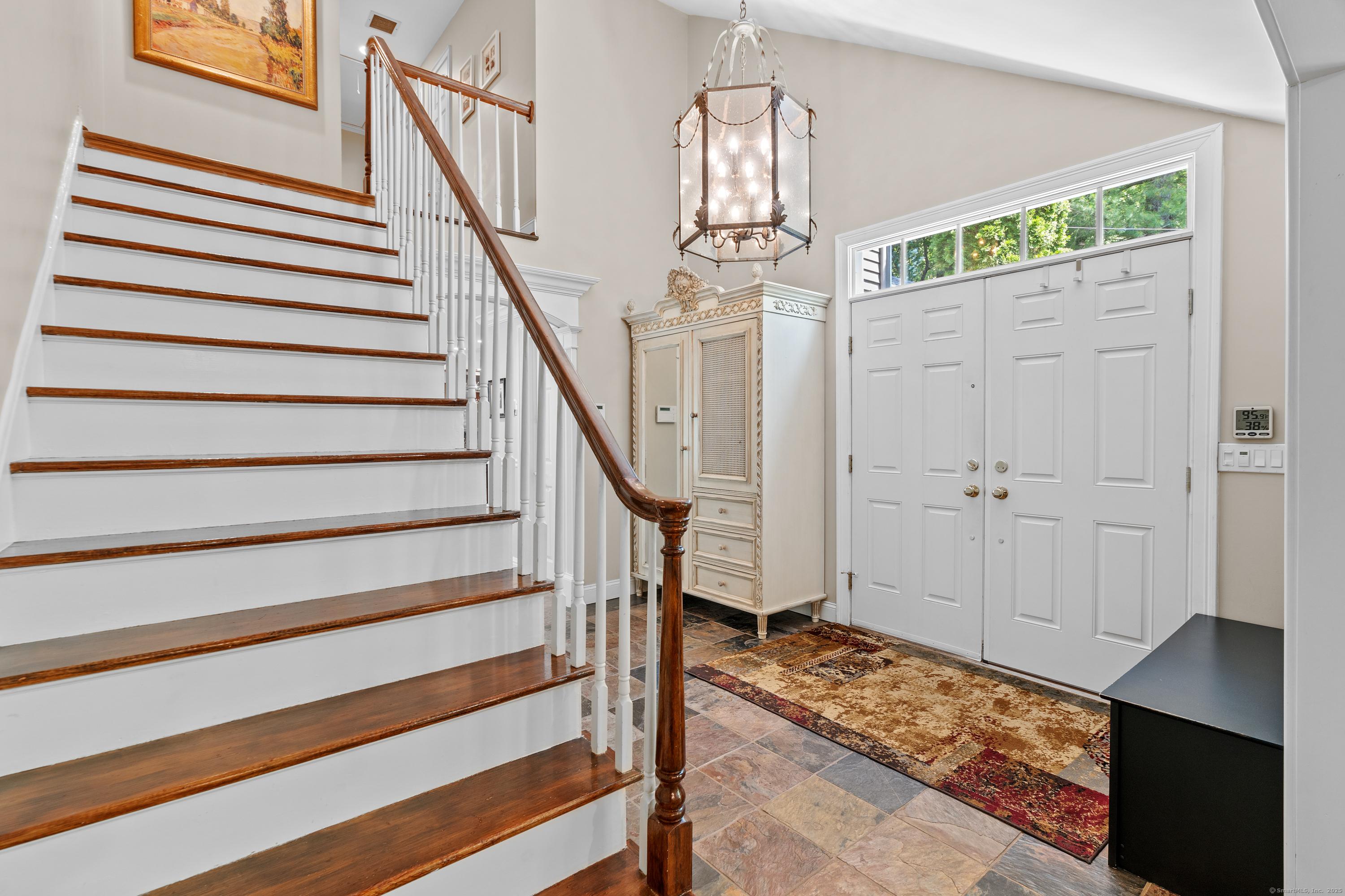 Image 3: The two-story foyer is grand and welcoming