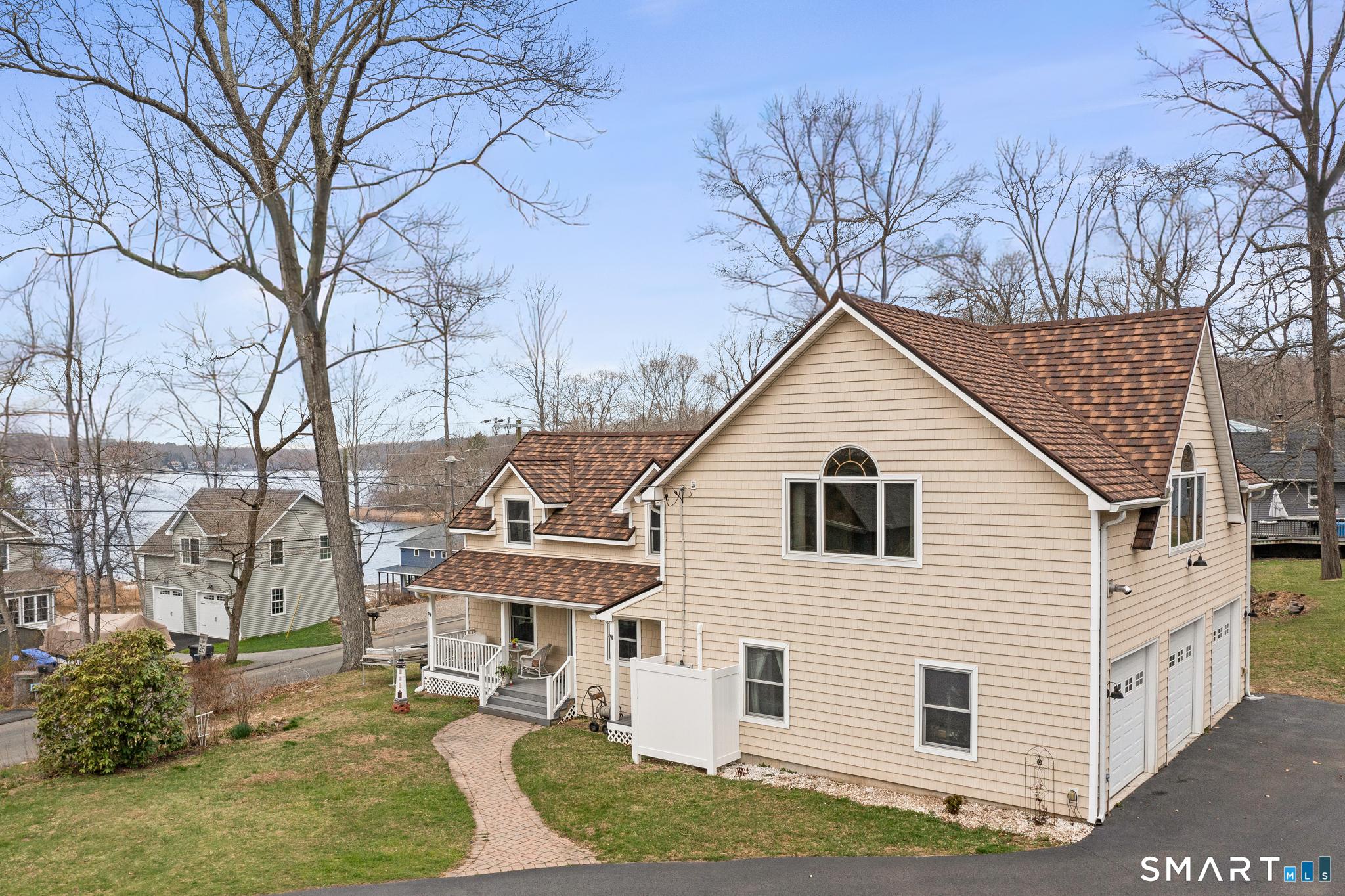 Image 1Lake: COVENTRY LAKE HOUSE! REMODELED 3 BEDROOM HOME WITH GREAT VIEWS OF COVENTRY LAKE!