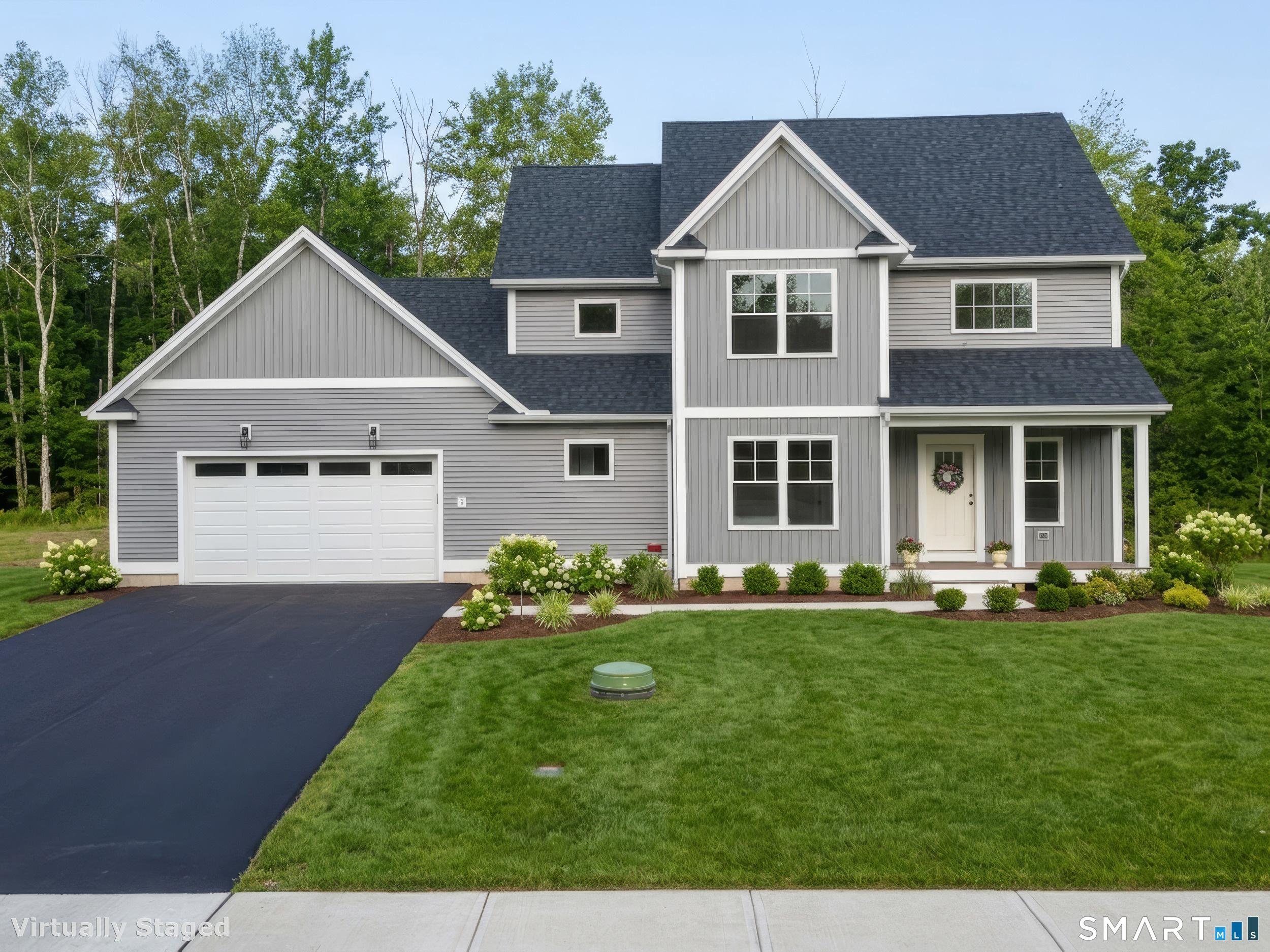 Image 3: Lawn and landscape are going in! This is a rendering of the home once those are complete
