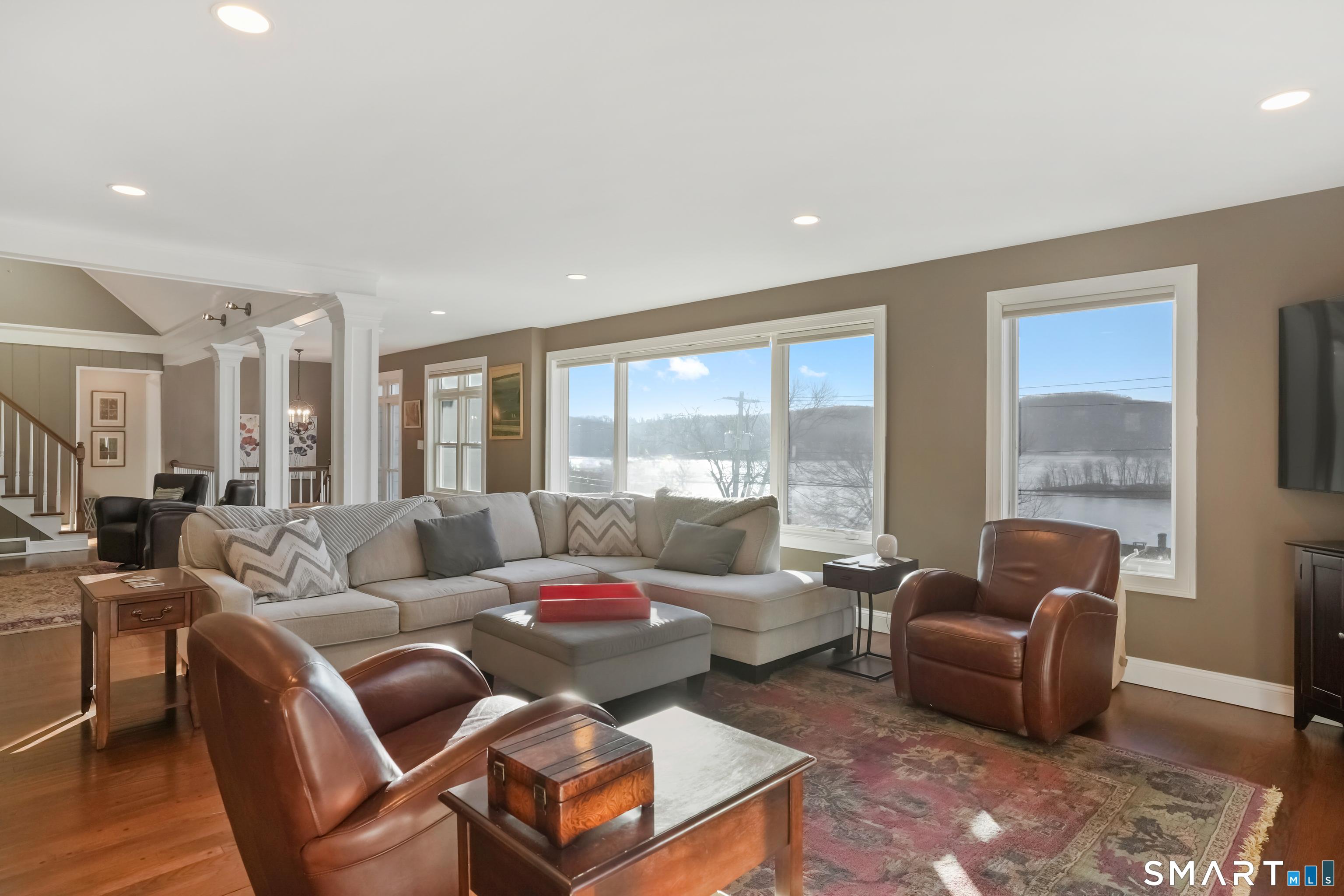 Image 4: Main living area with plenty of windows for lake views