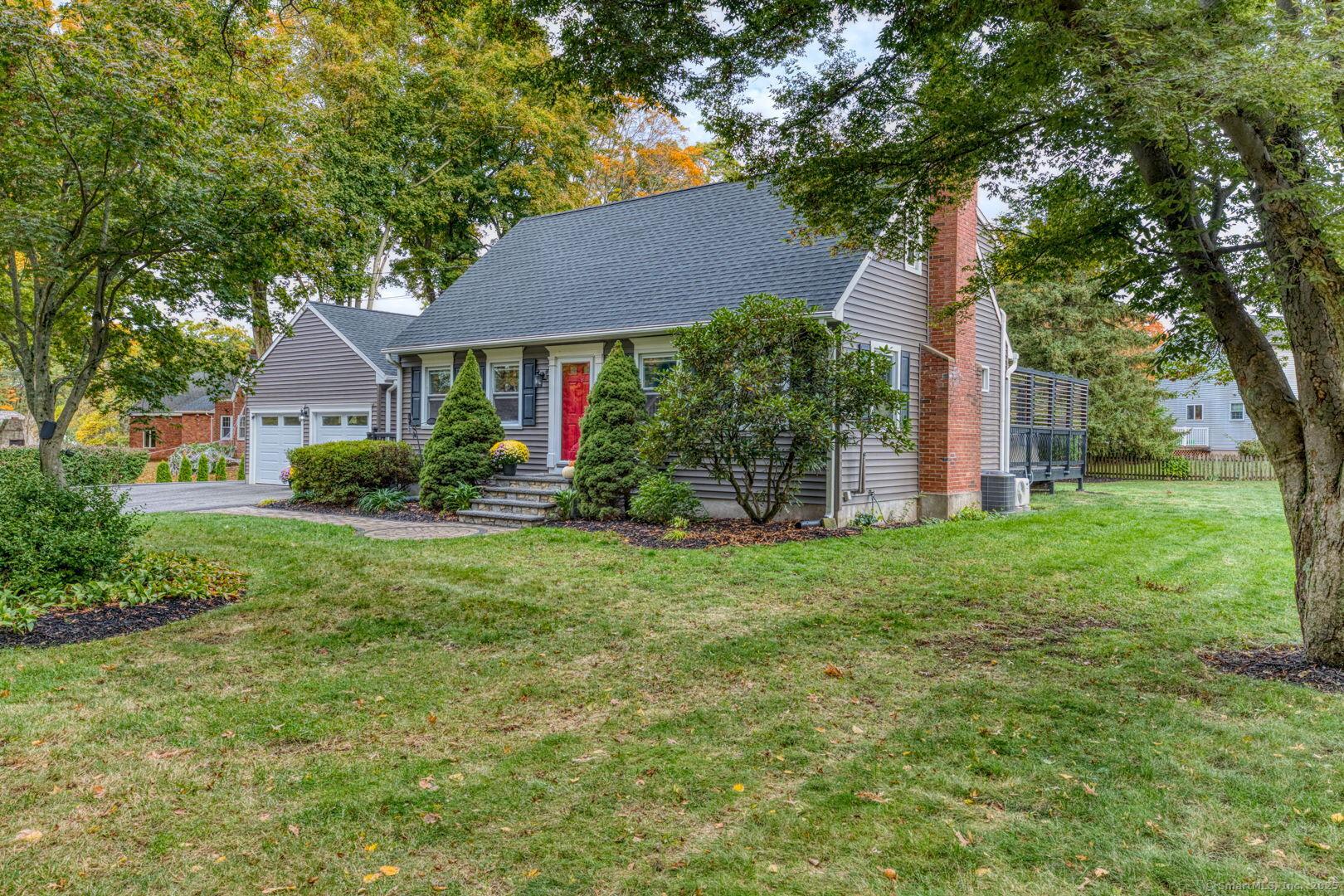 Image 3Side of Structure: Lightly treed, level lot on side street location