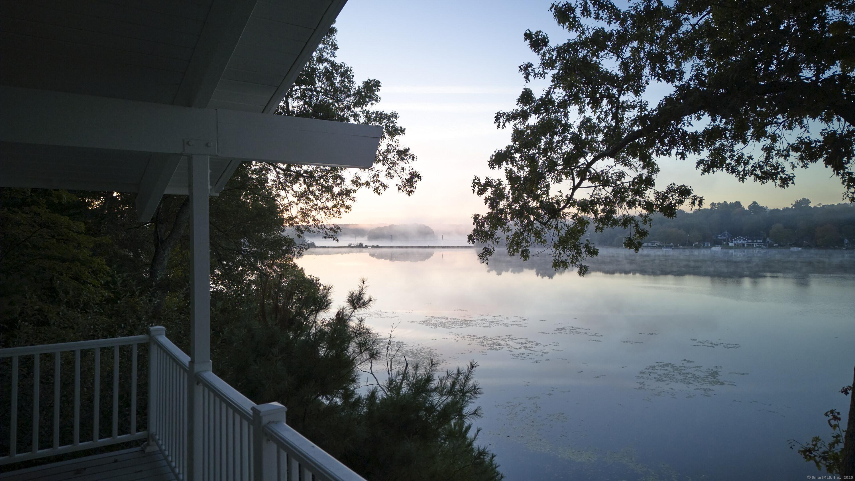 Image 3View: From the Porch - A view framed by columns and lake mist, right from your front steps.