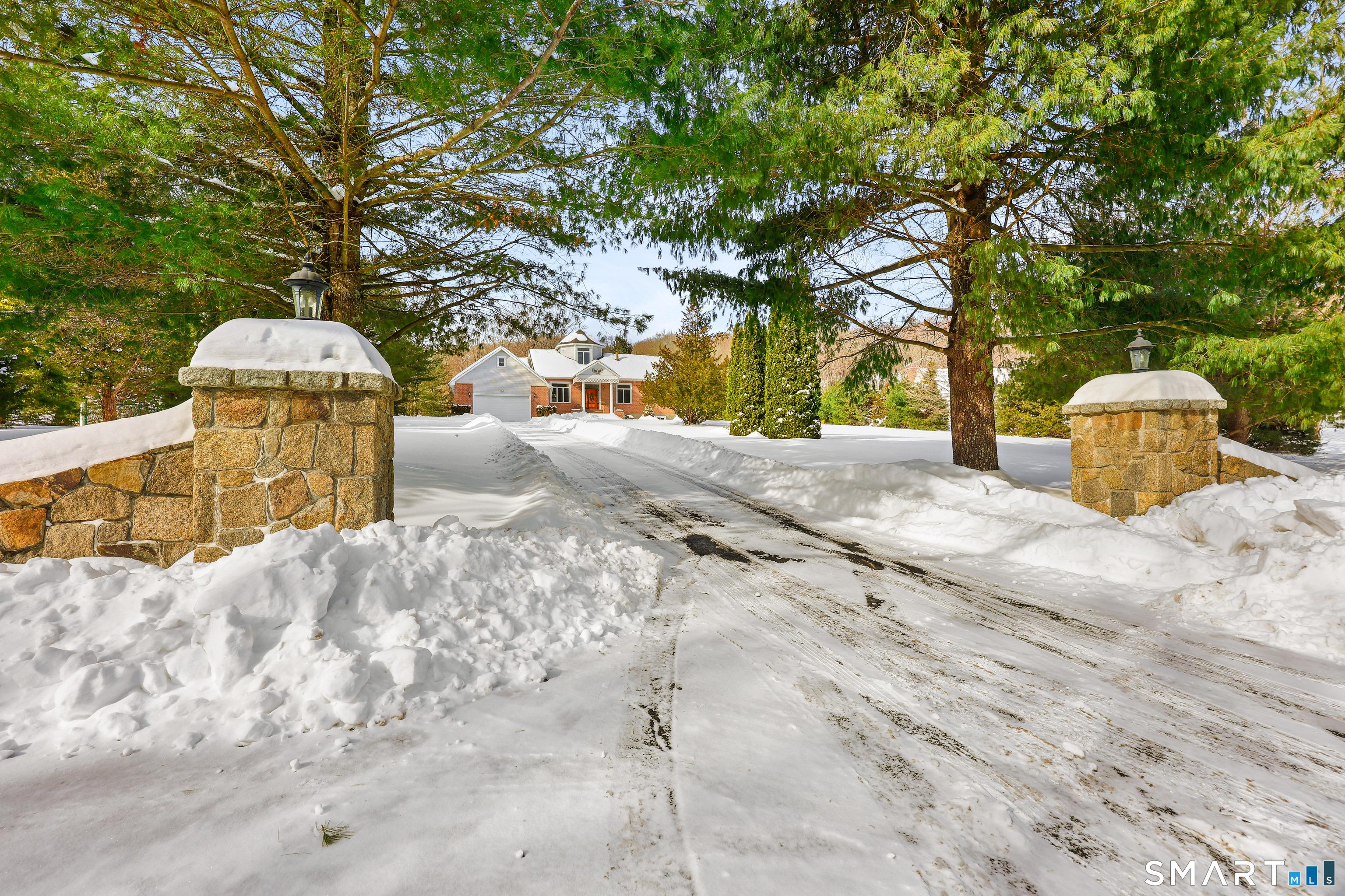 Image 1: striking stone pillar driveway entrance!