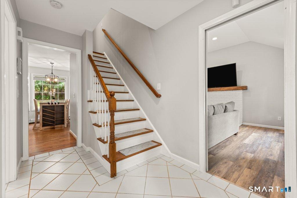 Image 3: Welcoming Foyer with a view into the family room and kitchen 