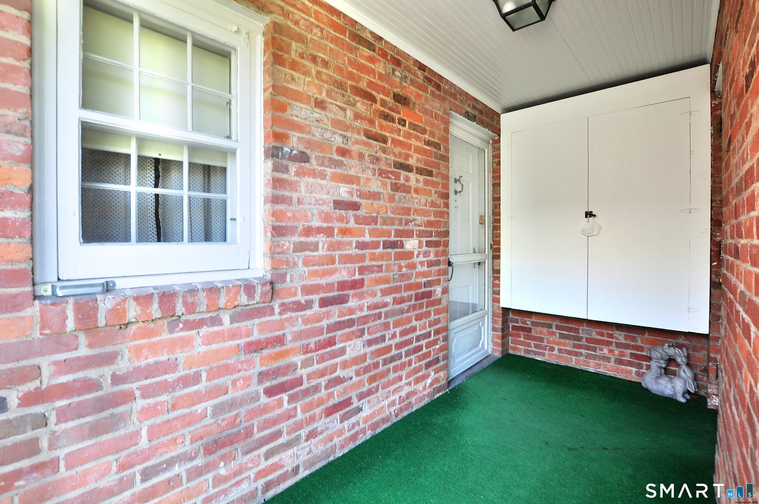 Image 4: Back door covered entrance