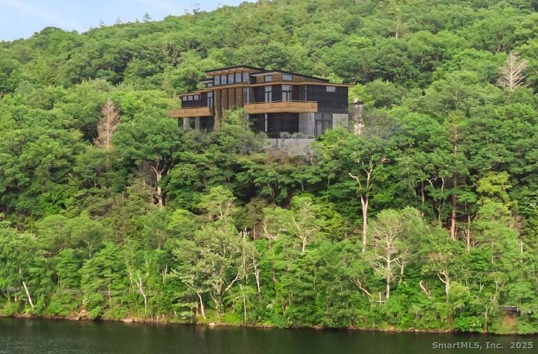 Image 1: Architectural rendering of a Frank Lloyd Wright-inspired Usonian home overlooking Lake Waramaug in New Preston.
